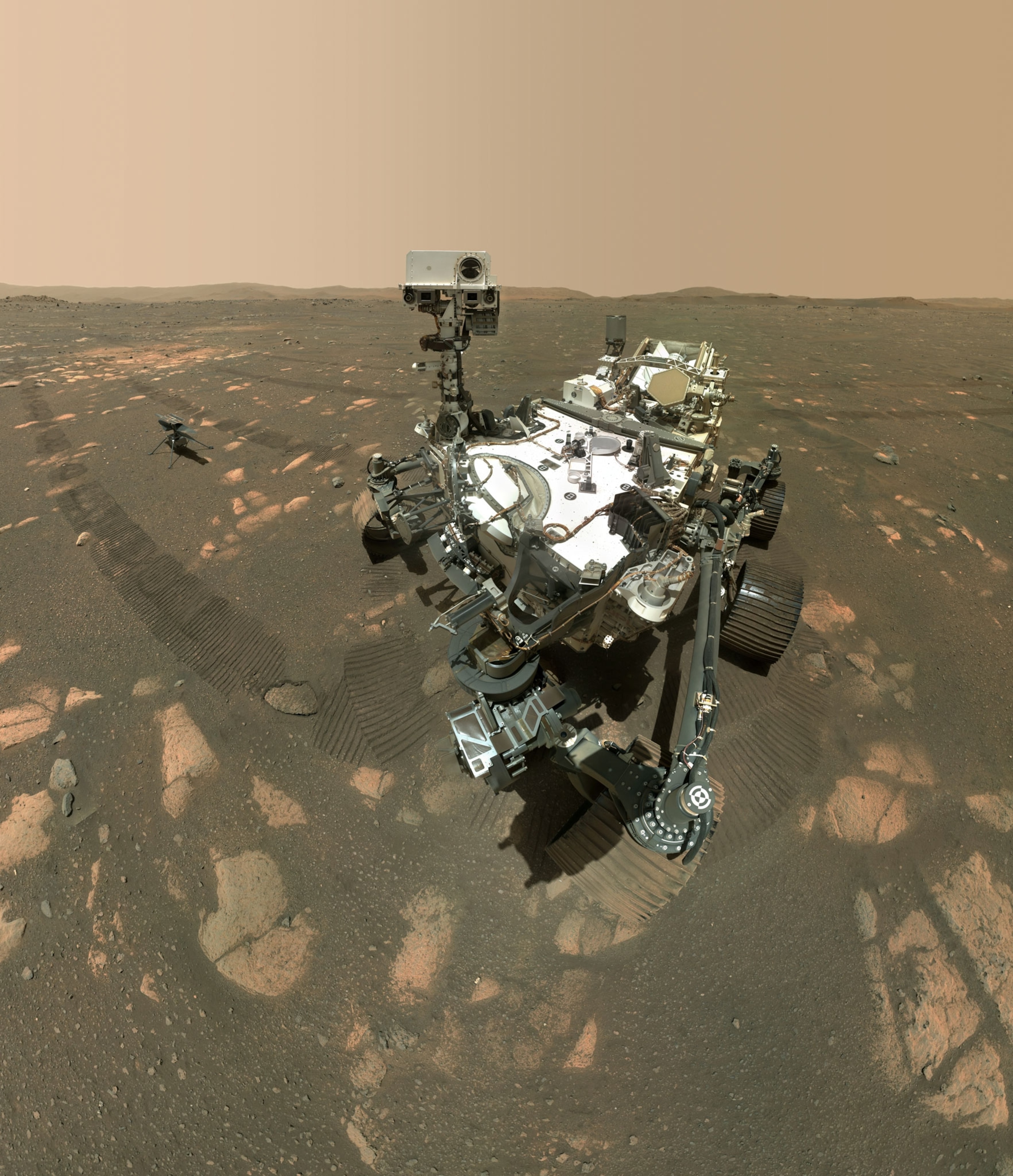 The Perseverance Mars rover's selfie with the Mars landscape in the background.