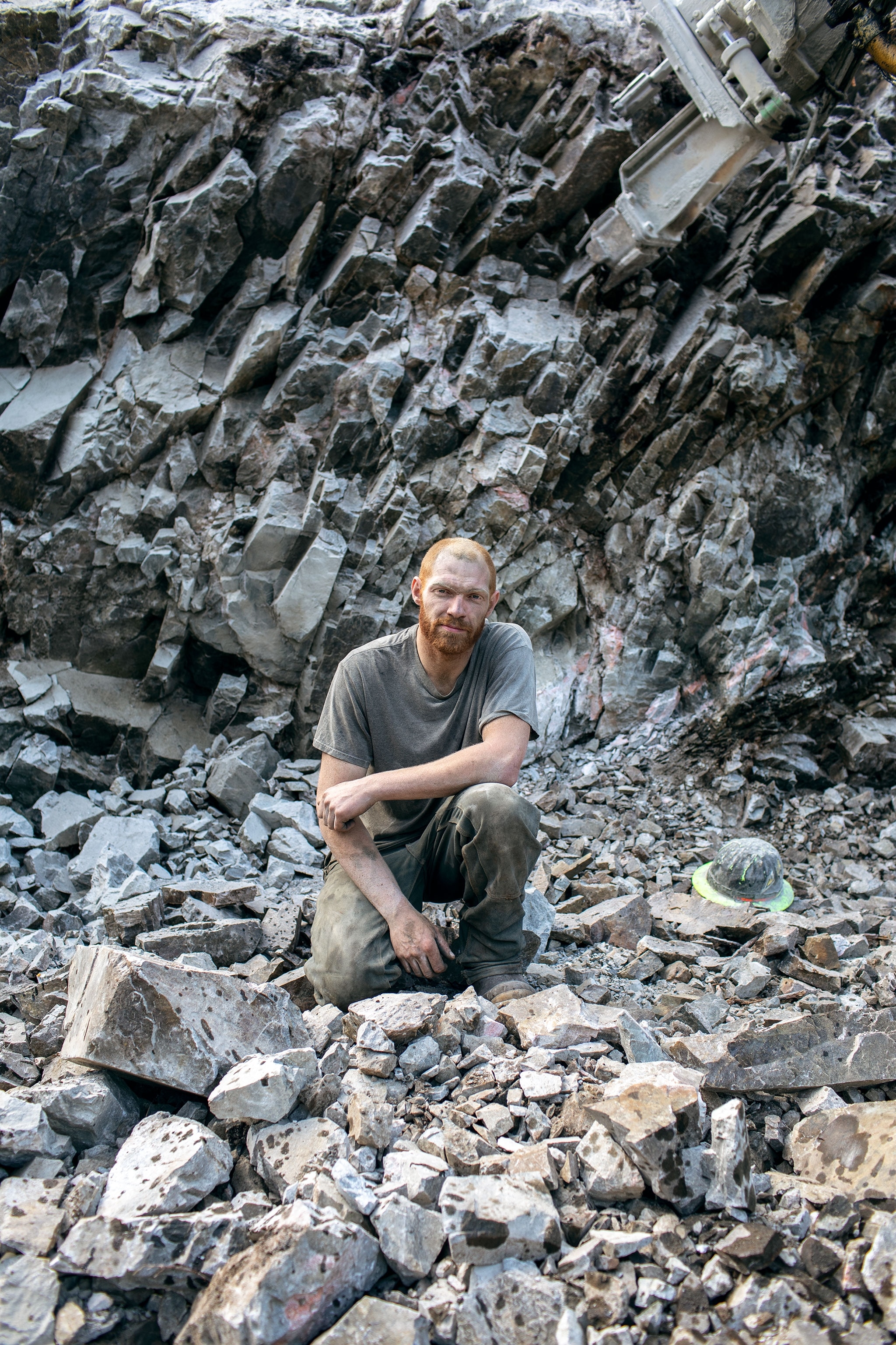 a man in rock blasted rubble