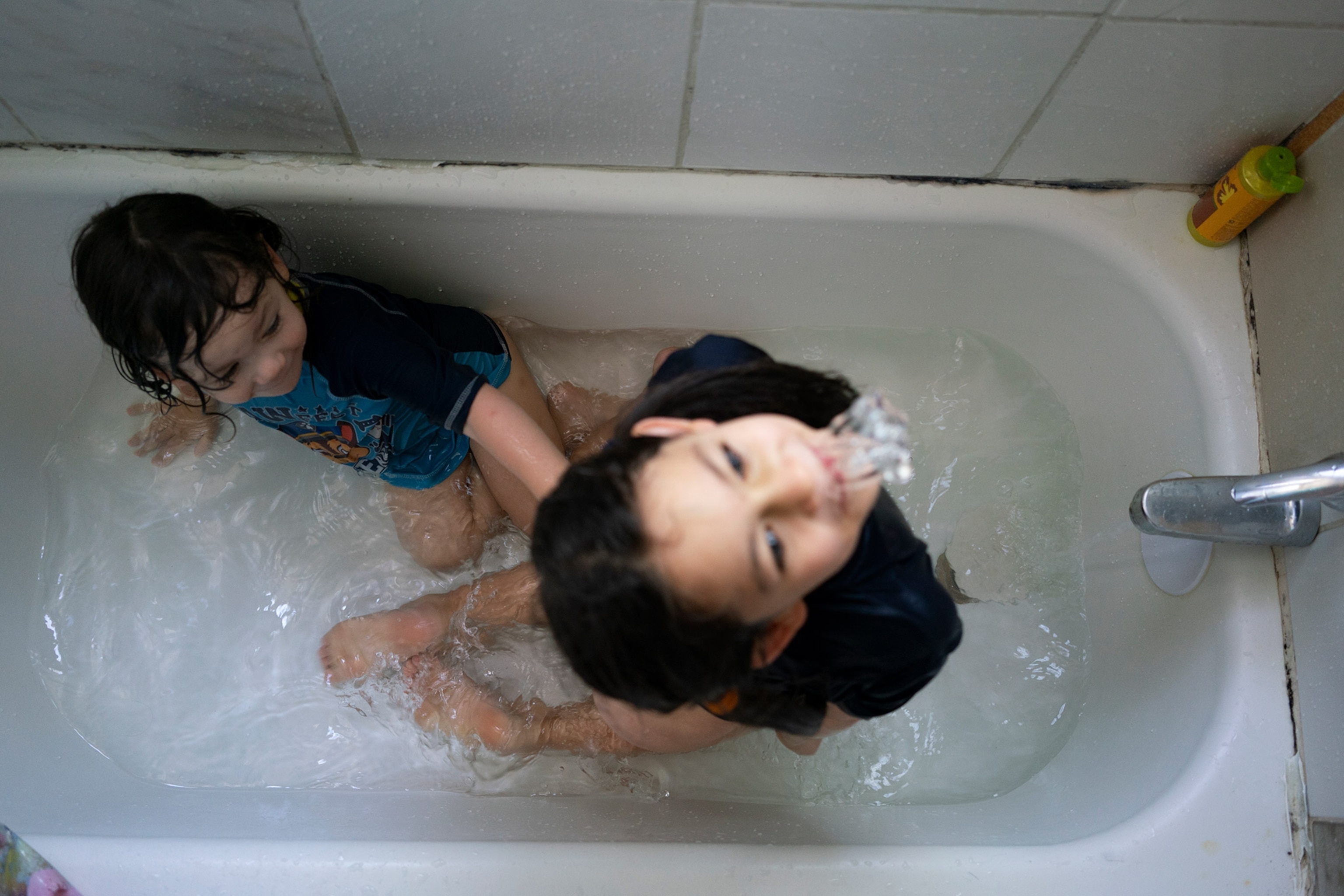 two brothers in a bathtub