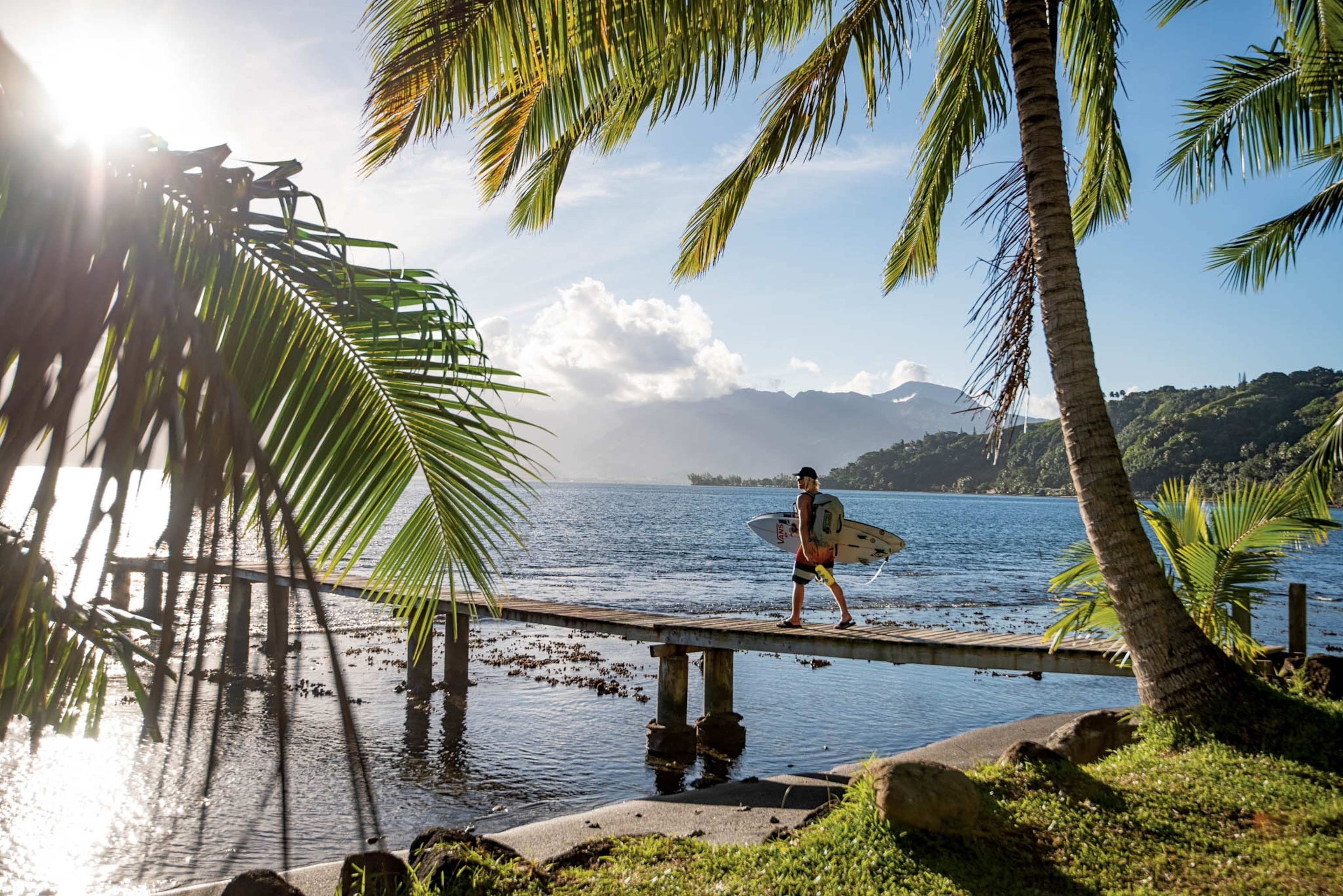 a surfer on a pier