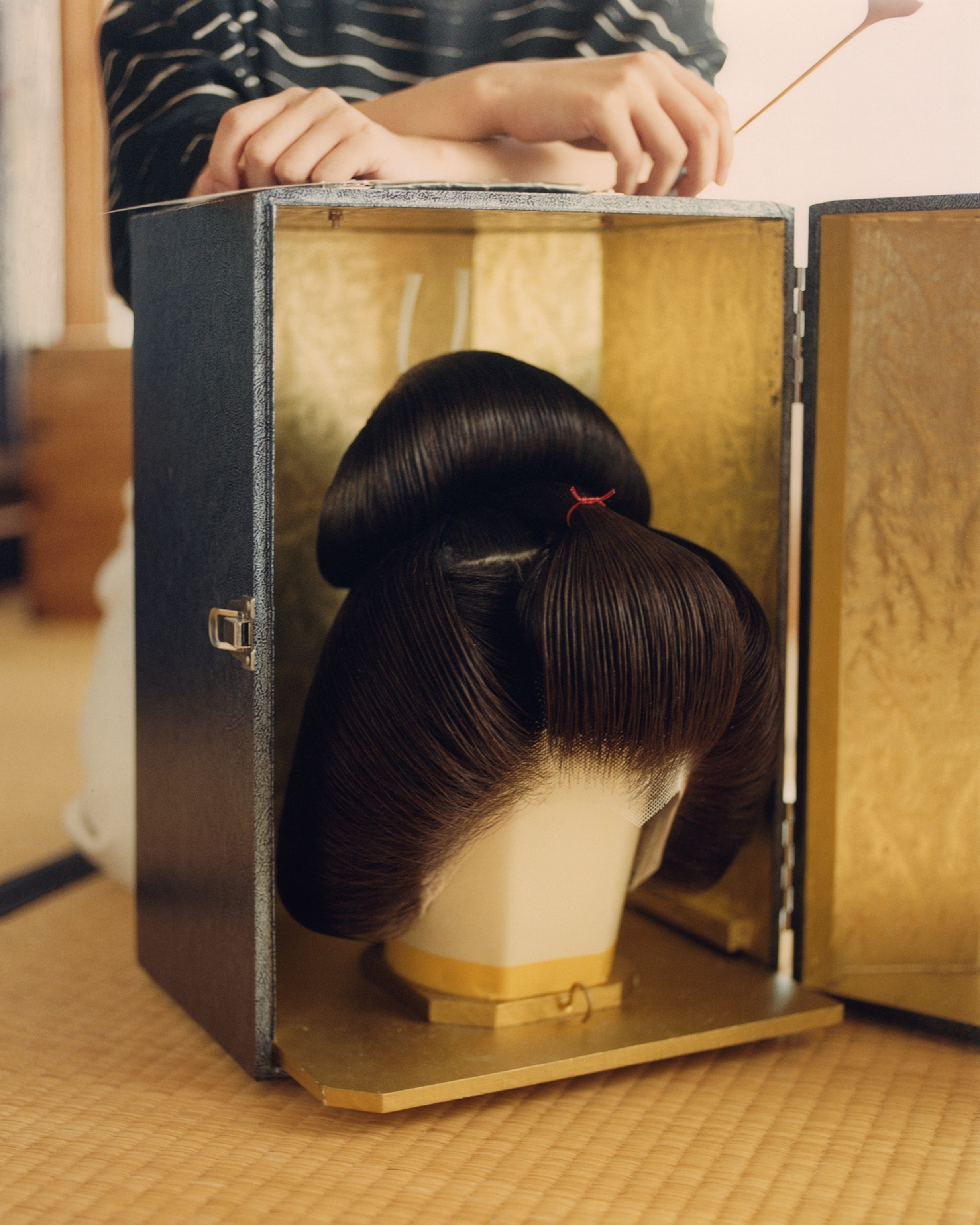 Shichiha and her geisha's wig.