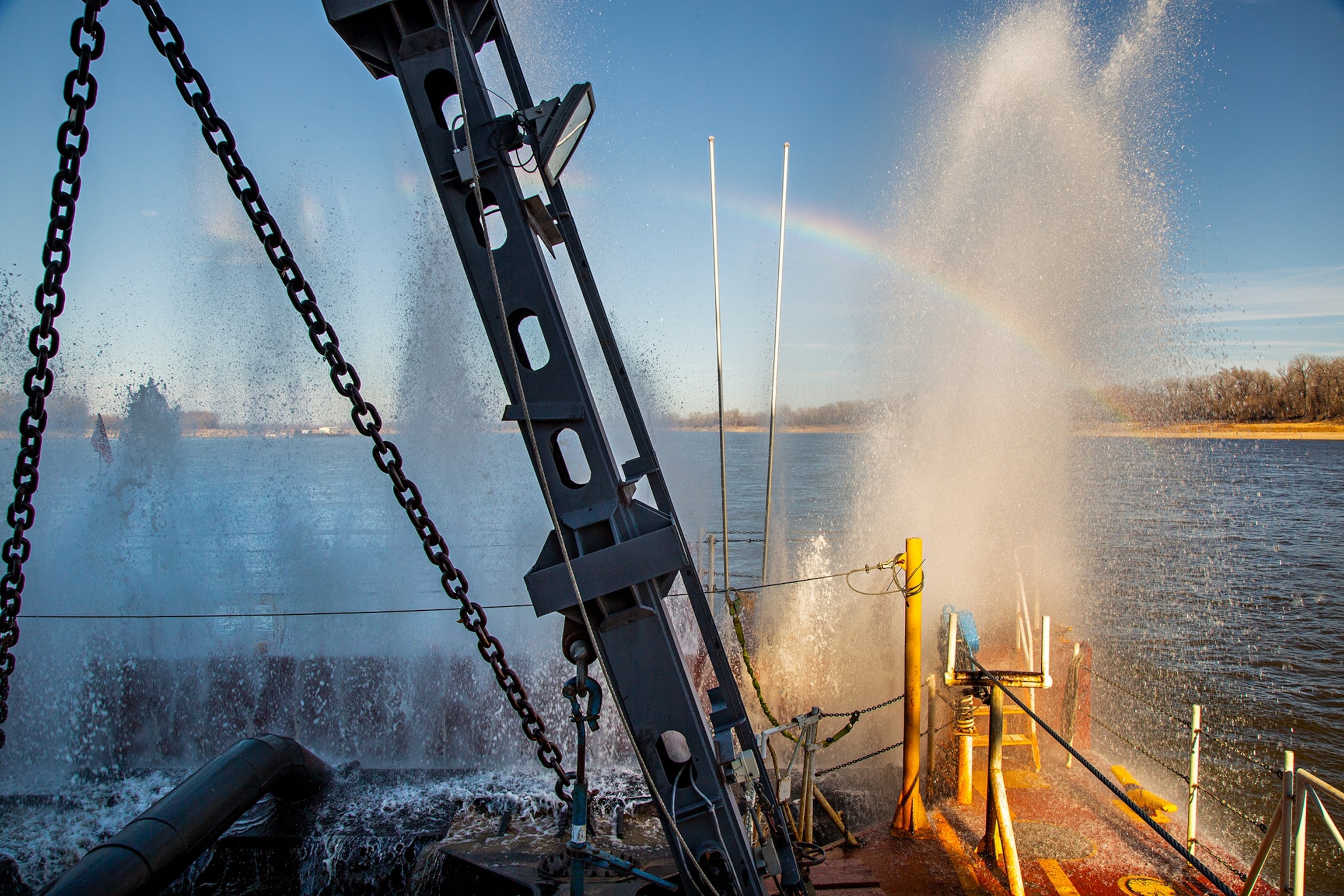 A rainbow glows in the water jets of the Dredge Potter.