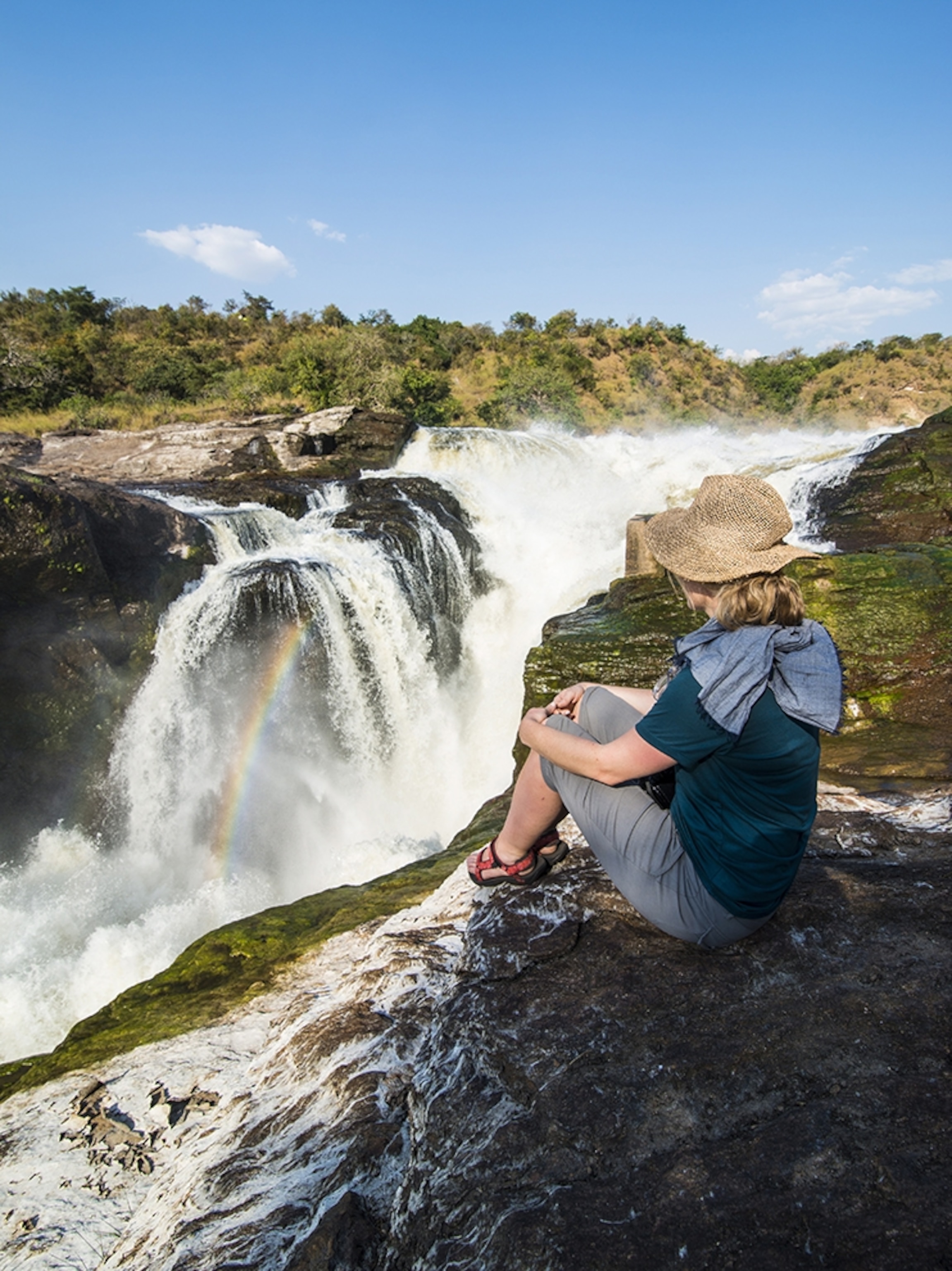 a woman looking at Murchison Falls (Kabarega Falls), Murchison Falls National Park, Uganda, East Africa, Africa