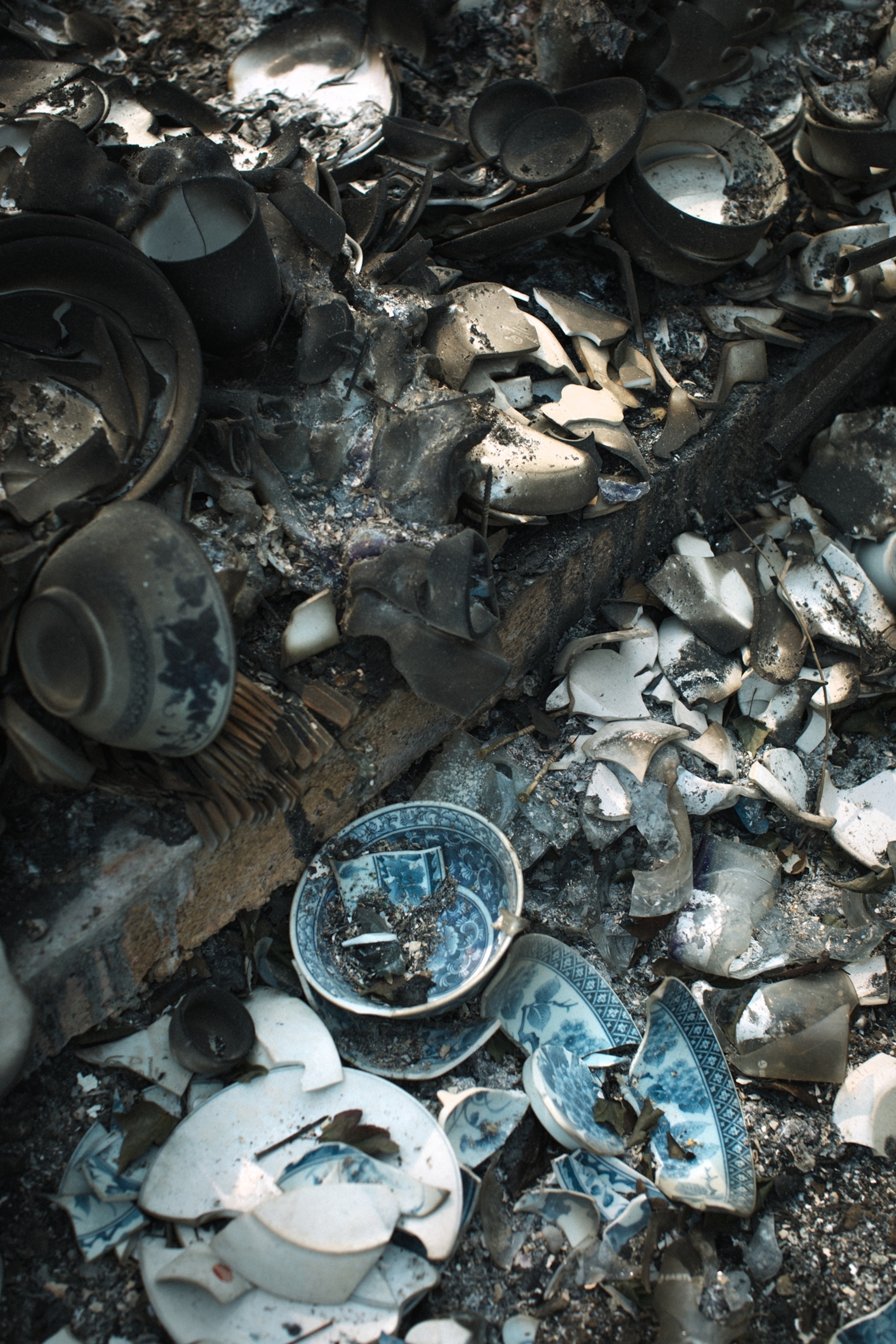 porcelain dishes crumbled in the ashes