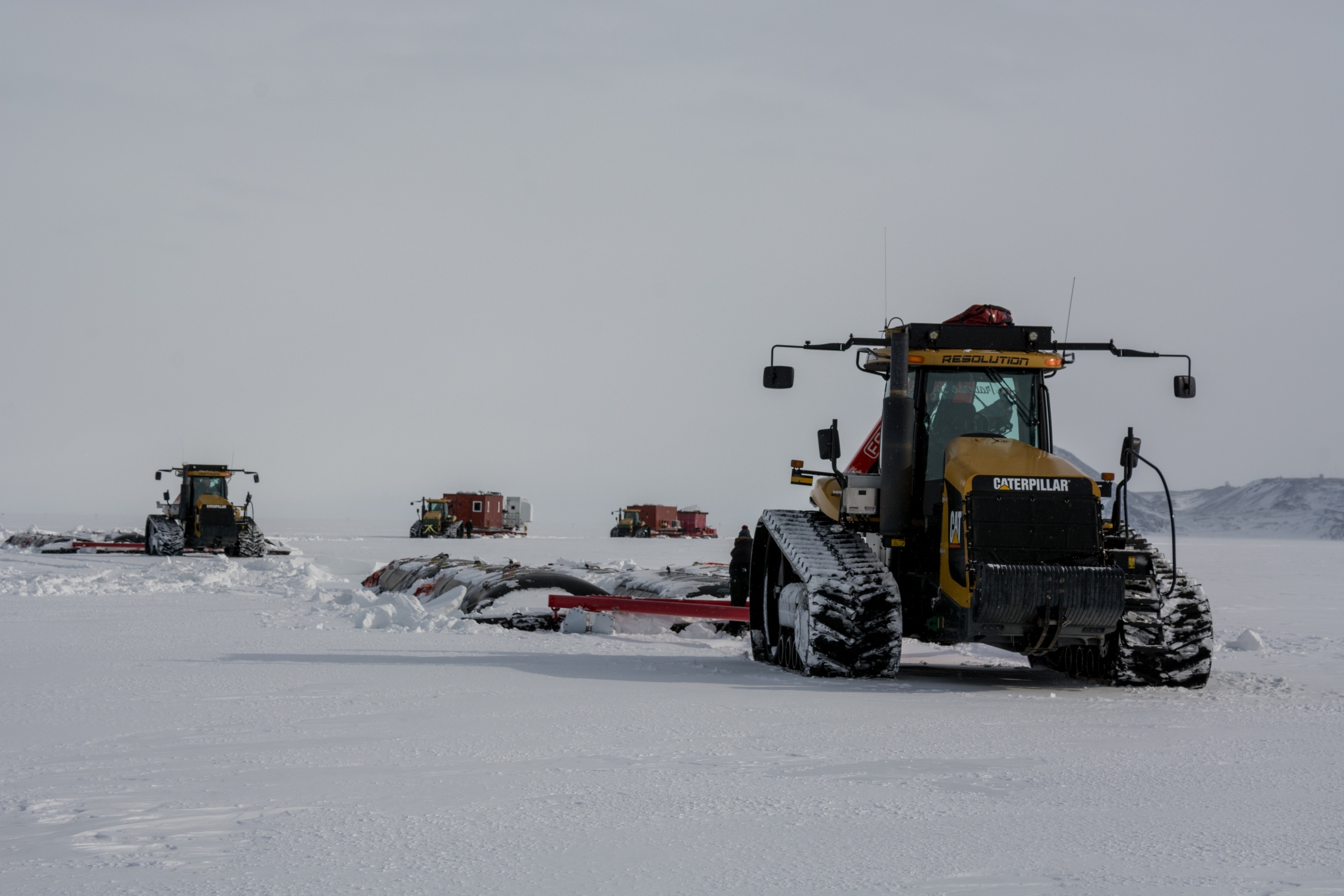 tractors grooming the spot road in antarctica