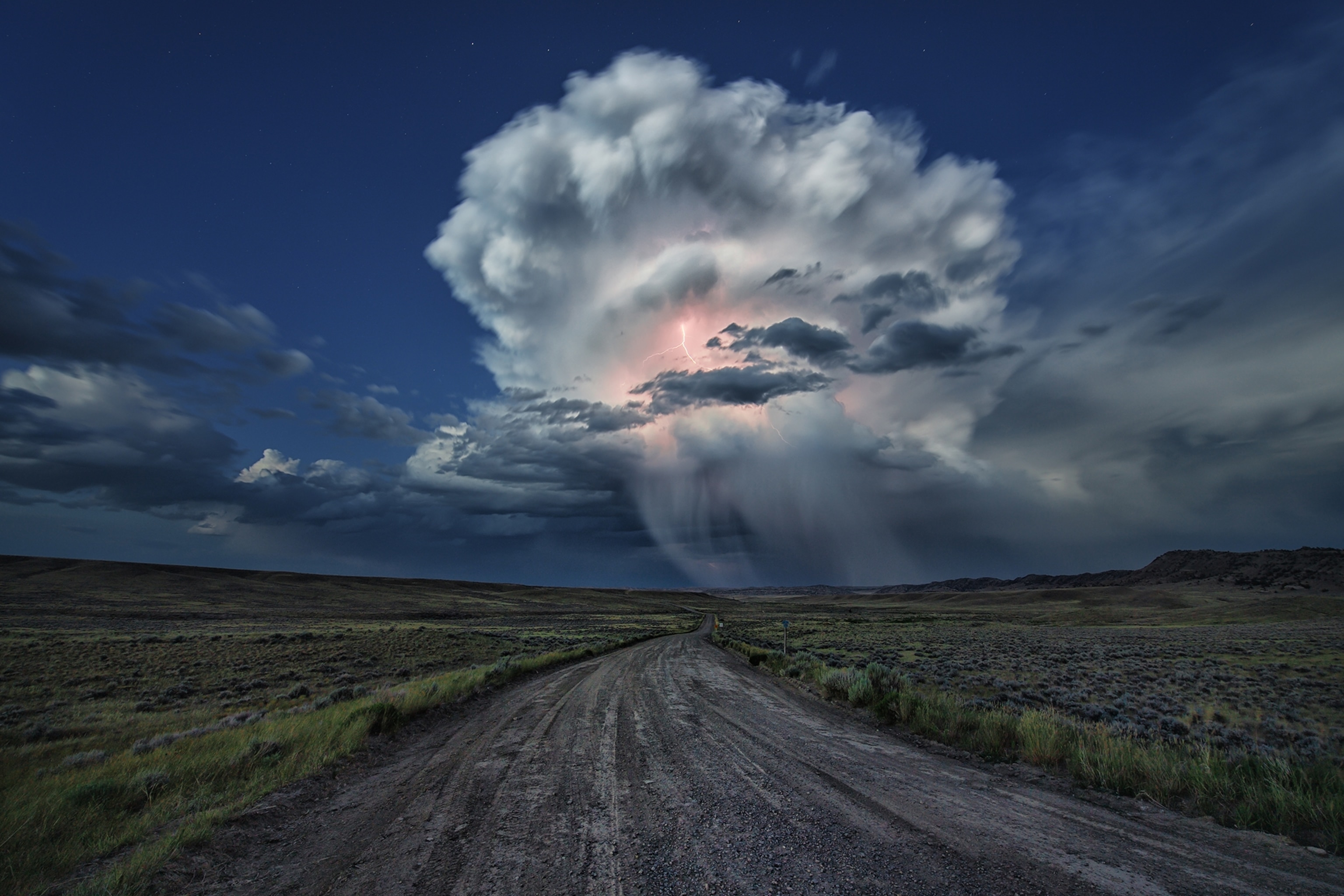 a thundercloud over a road