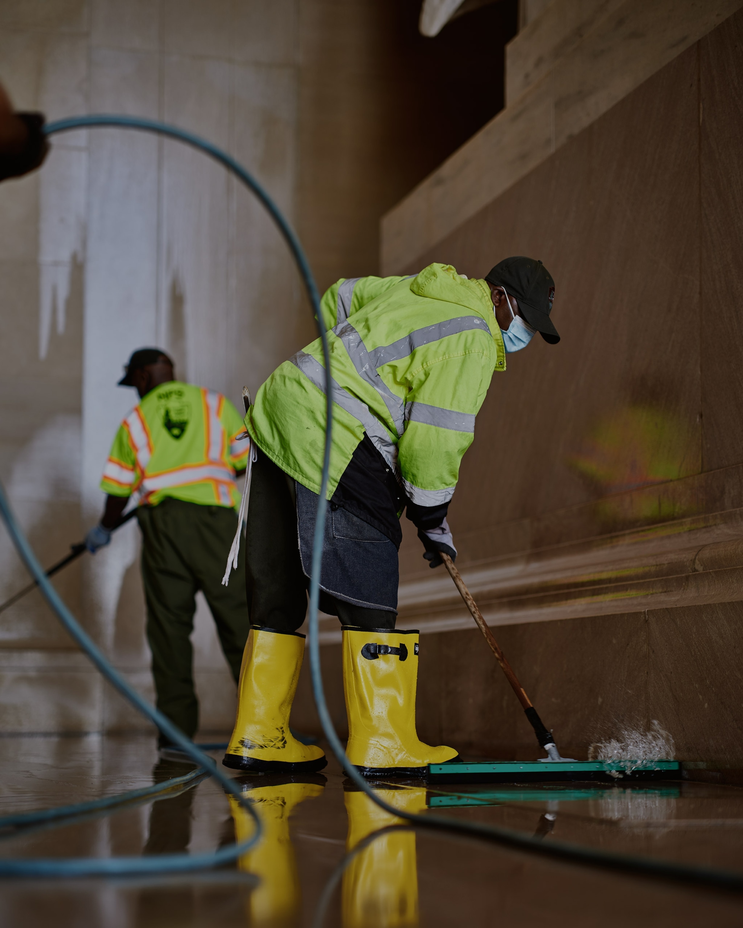 NPS staff members clean the base of the Lincoln statue at the Lincoln Memorial in anticipation of its centennial anniversary