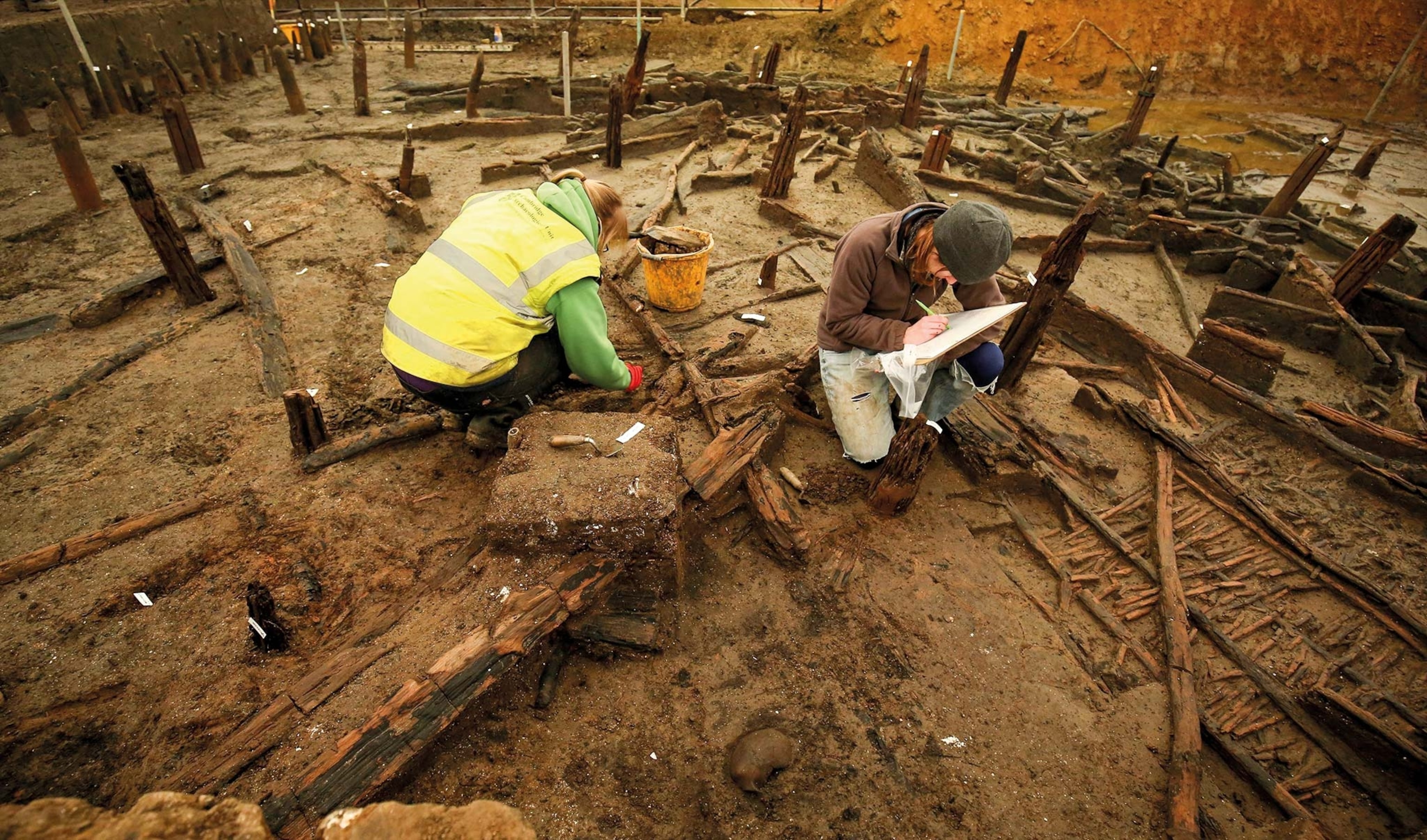 Archaeologists excavate the ancient river course at Must Farm