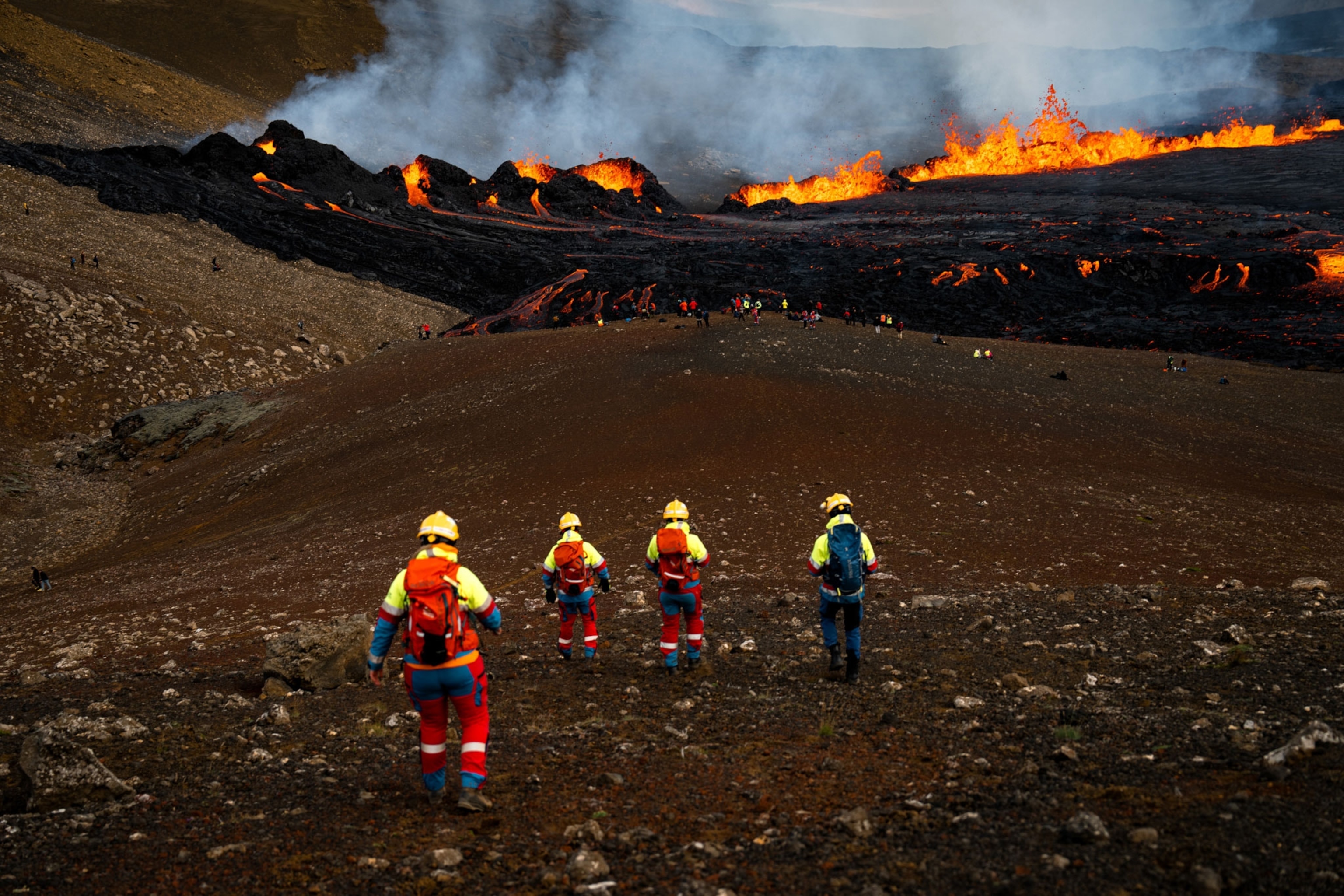 Workers at the eruption site