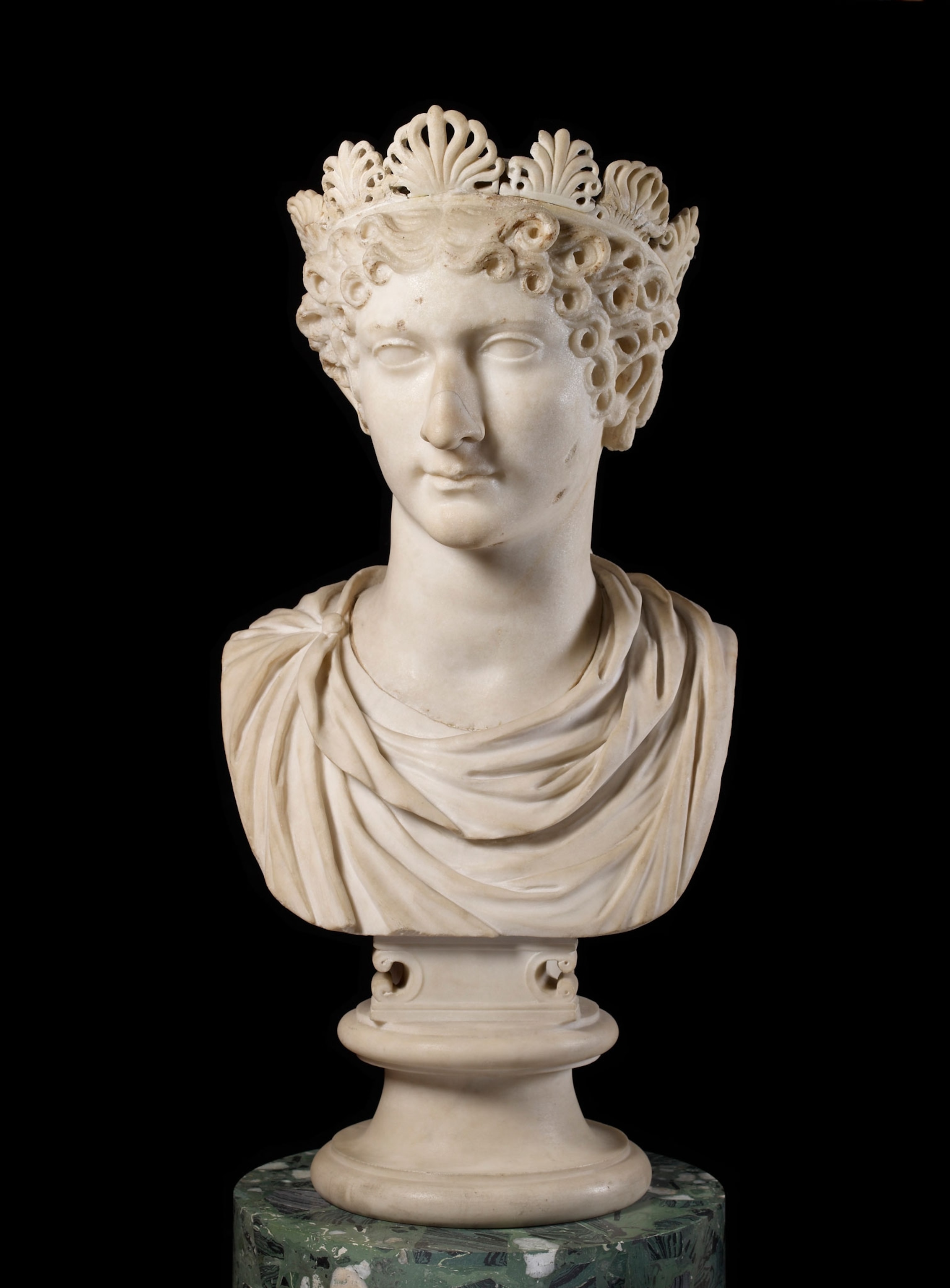 a white marble bust of a woman