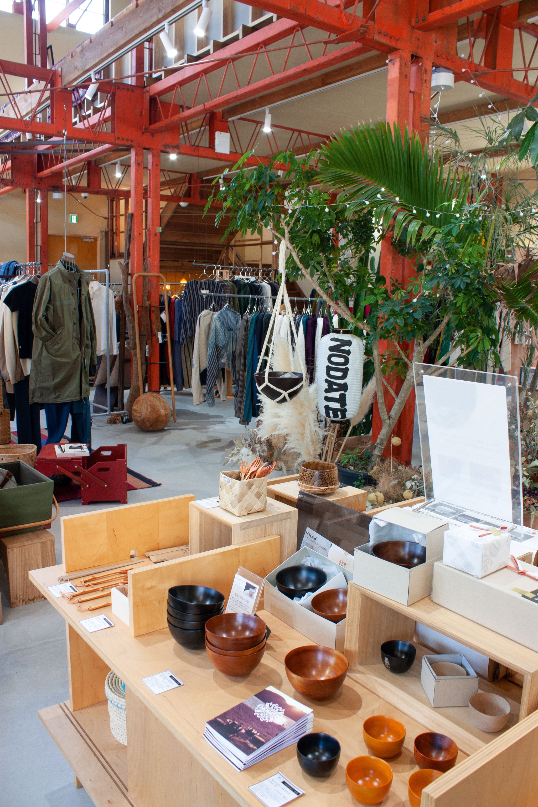 interior of store featuring ceramic bowls and clothing