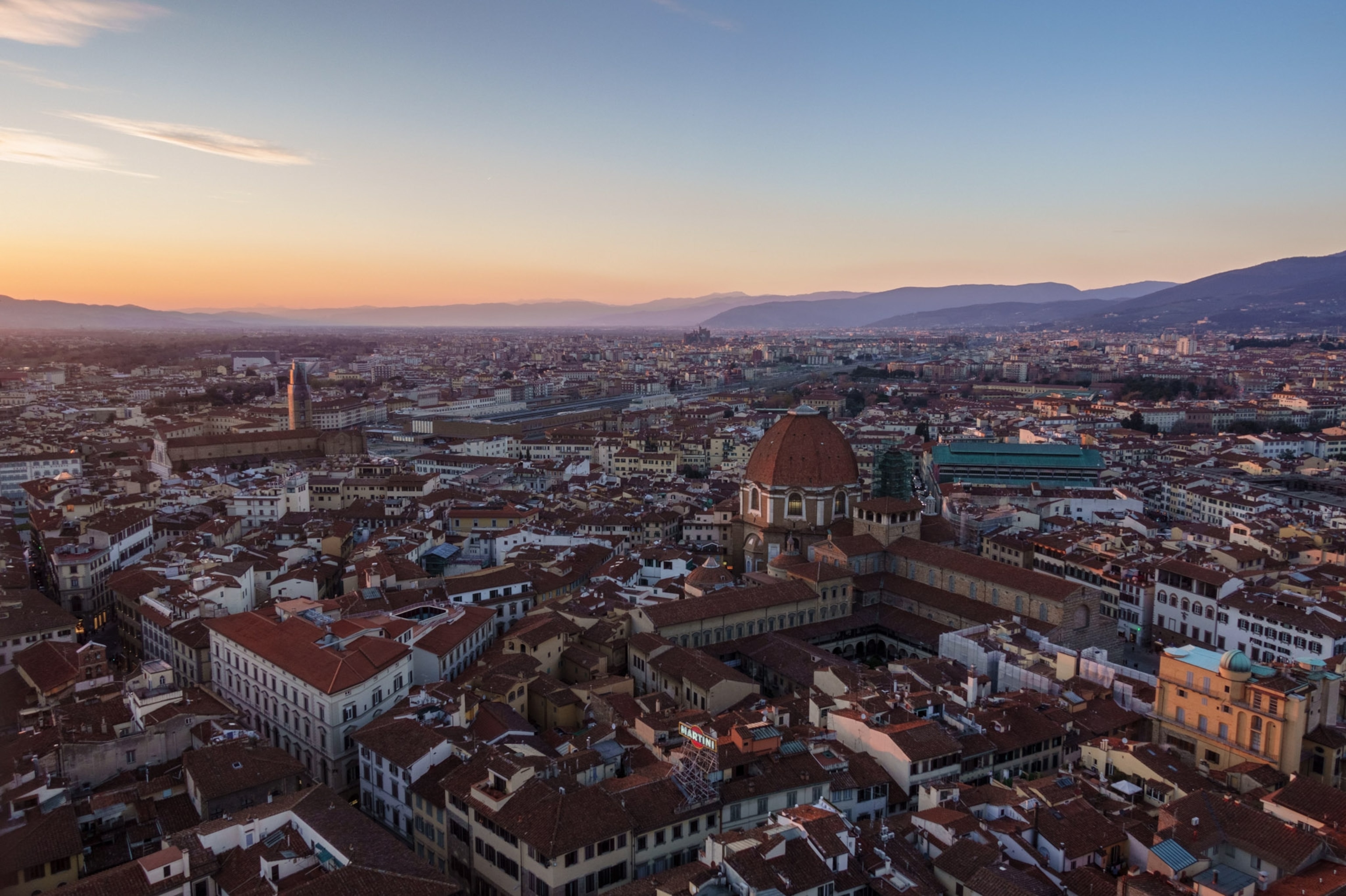 Sunset over Florance with a view of the chapels dome from above.