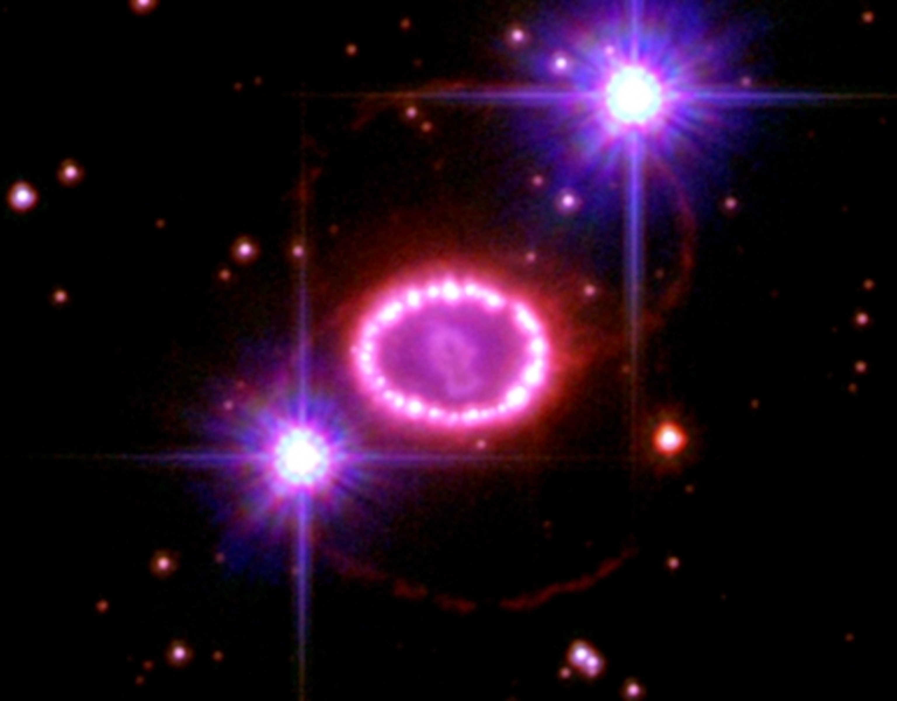 glowing cosmic debris resembling pearl necklace