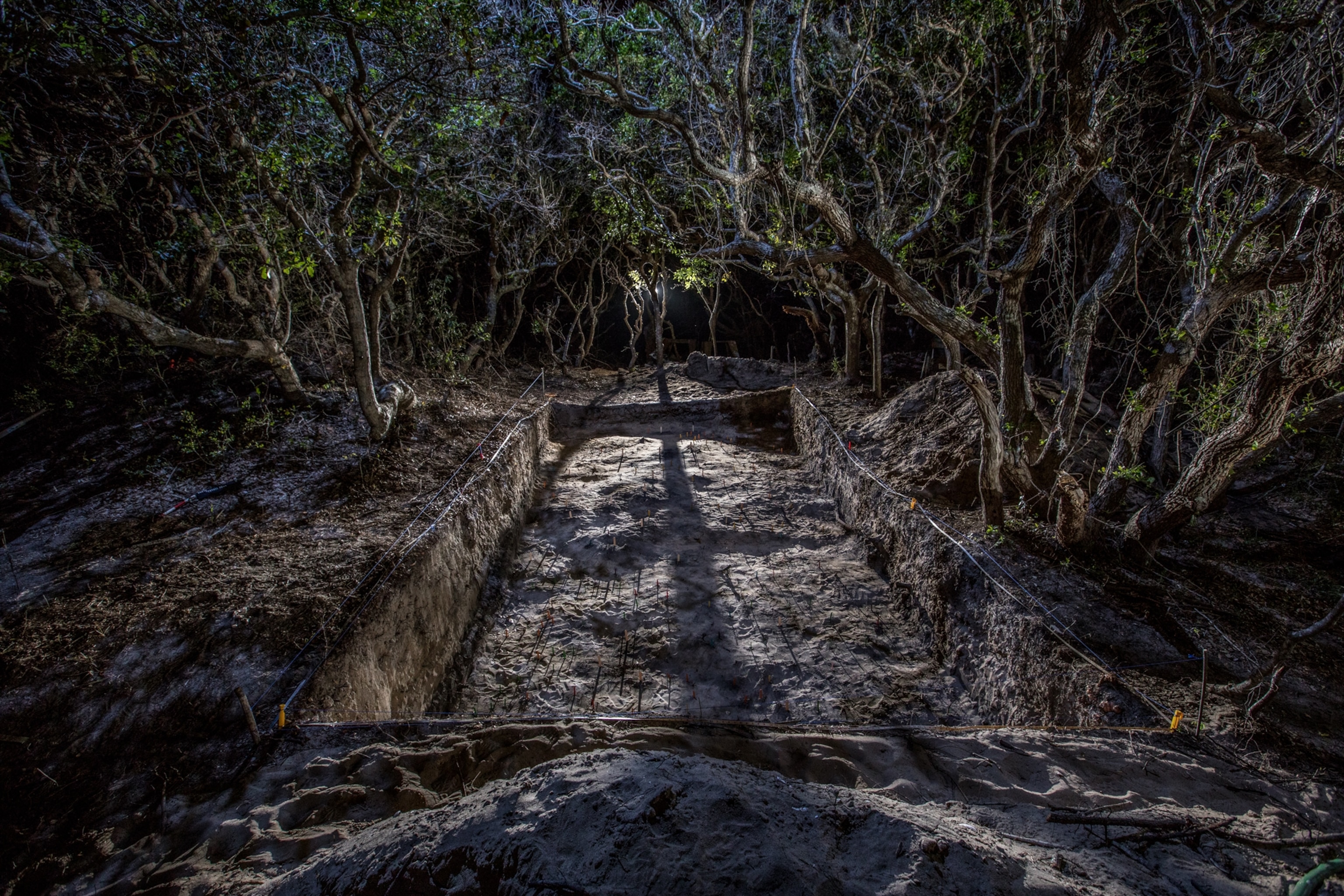 an excavations site in a Native American town on Hatteras Island at night.