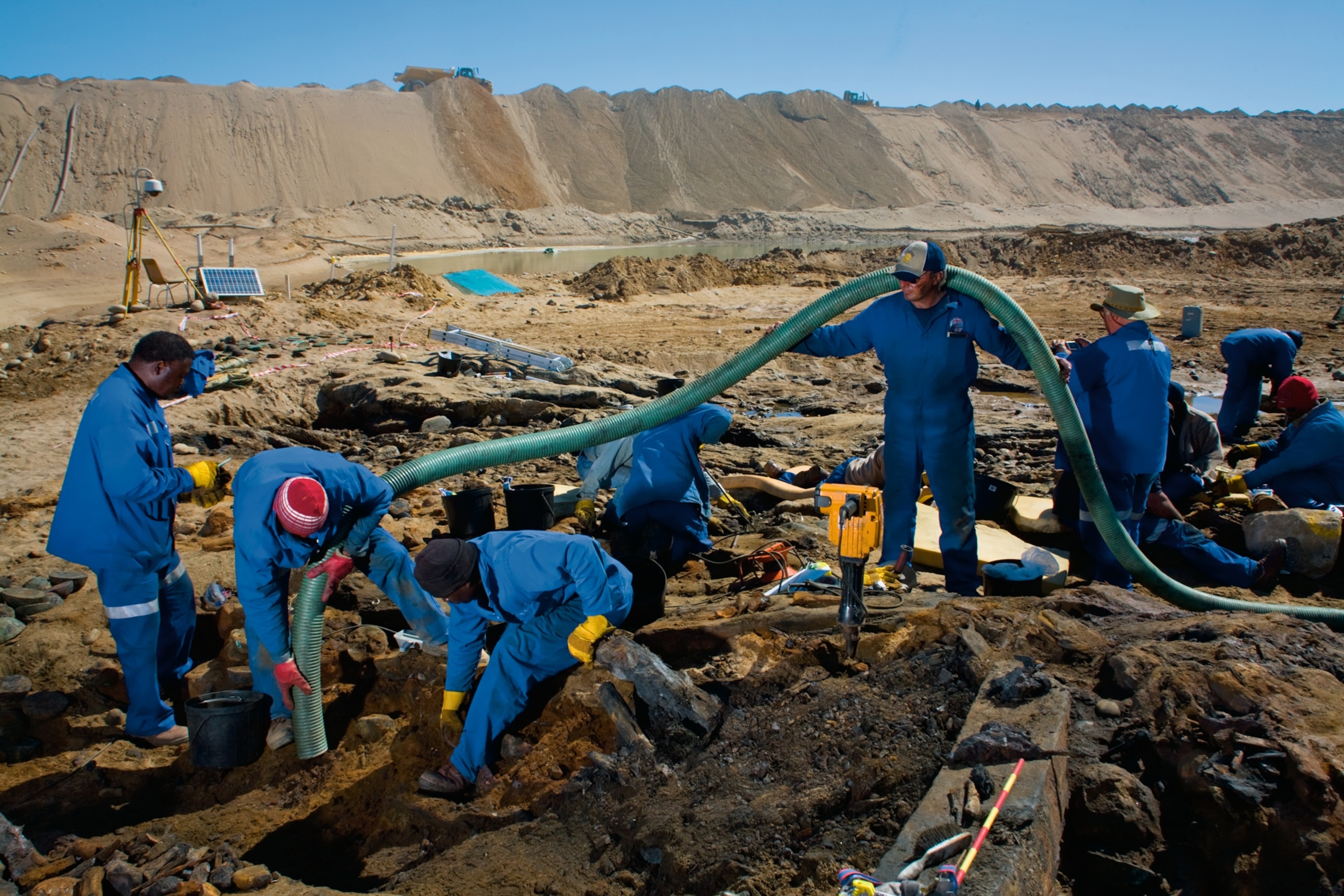 miners and archaeologists salvaging the remains of the ship and its cargo of riches