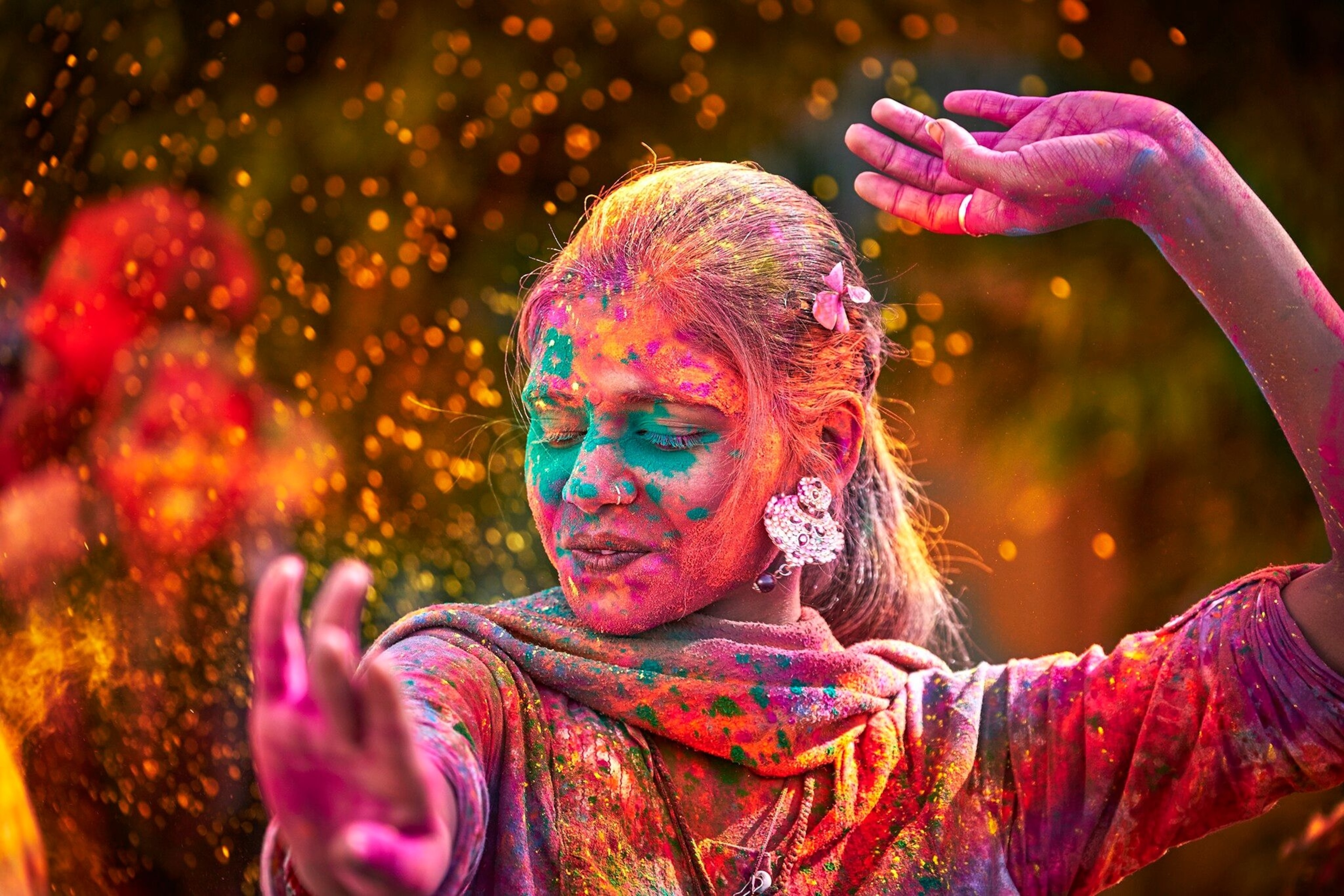 Rainbowed revellers throw gulal pigments into the air to celebrate springtime and the triumph of good over evil during Holi, an annual Hindu festival of colour.
