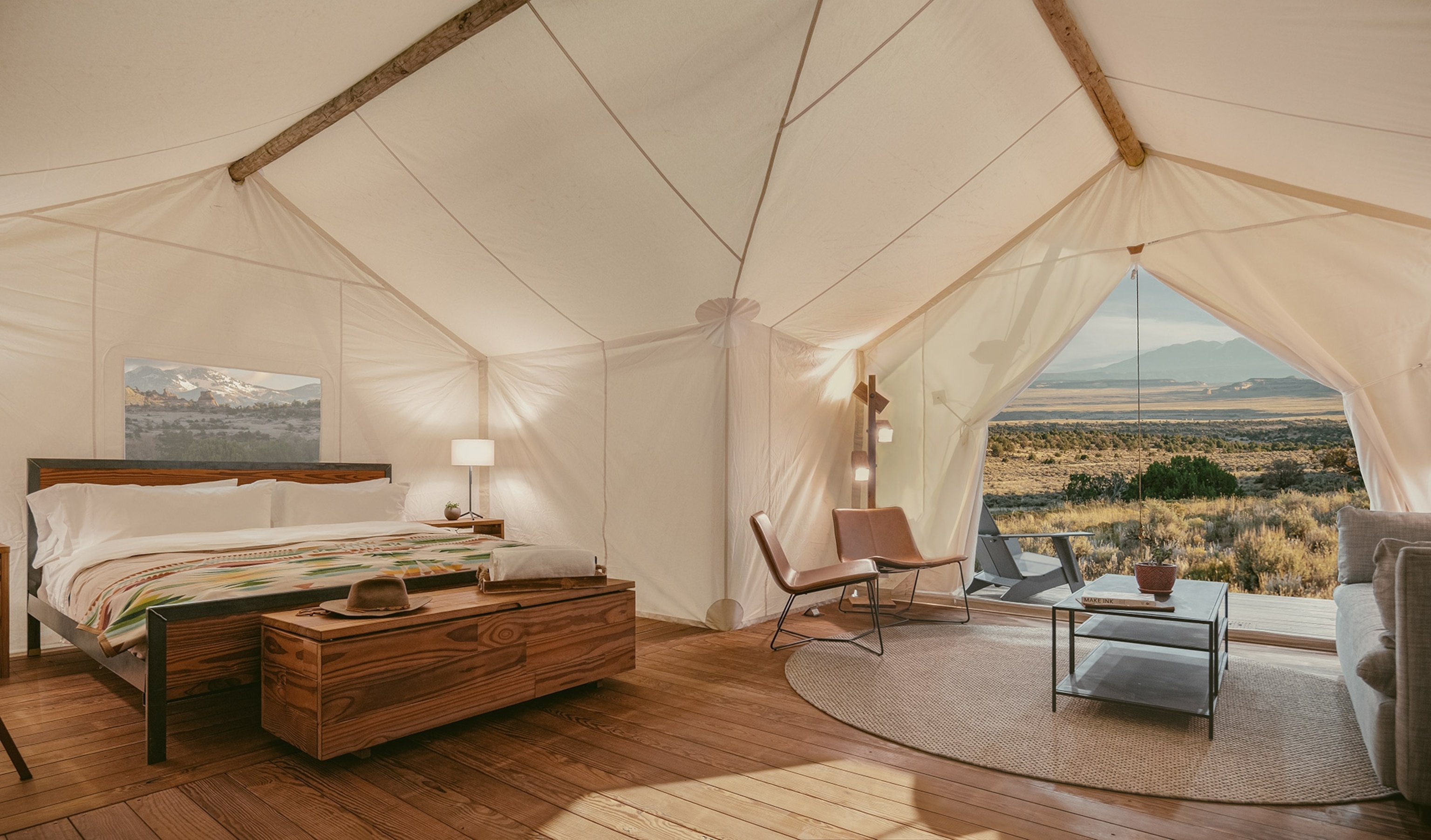 The interior of a tent show a view into the world around.