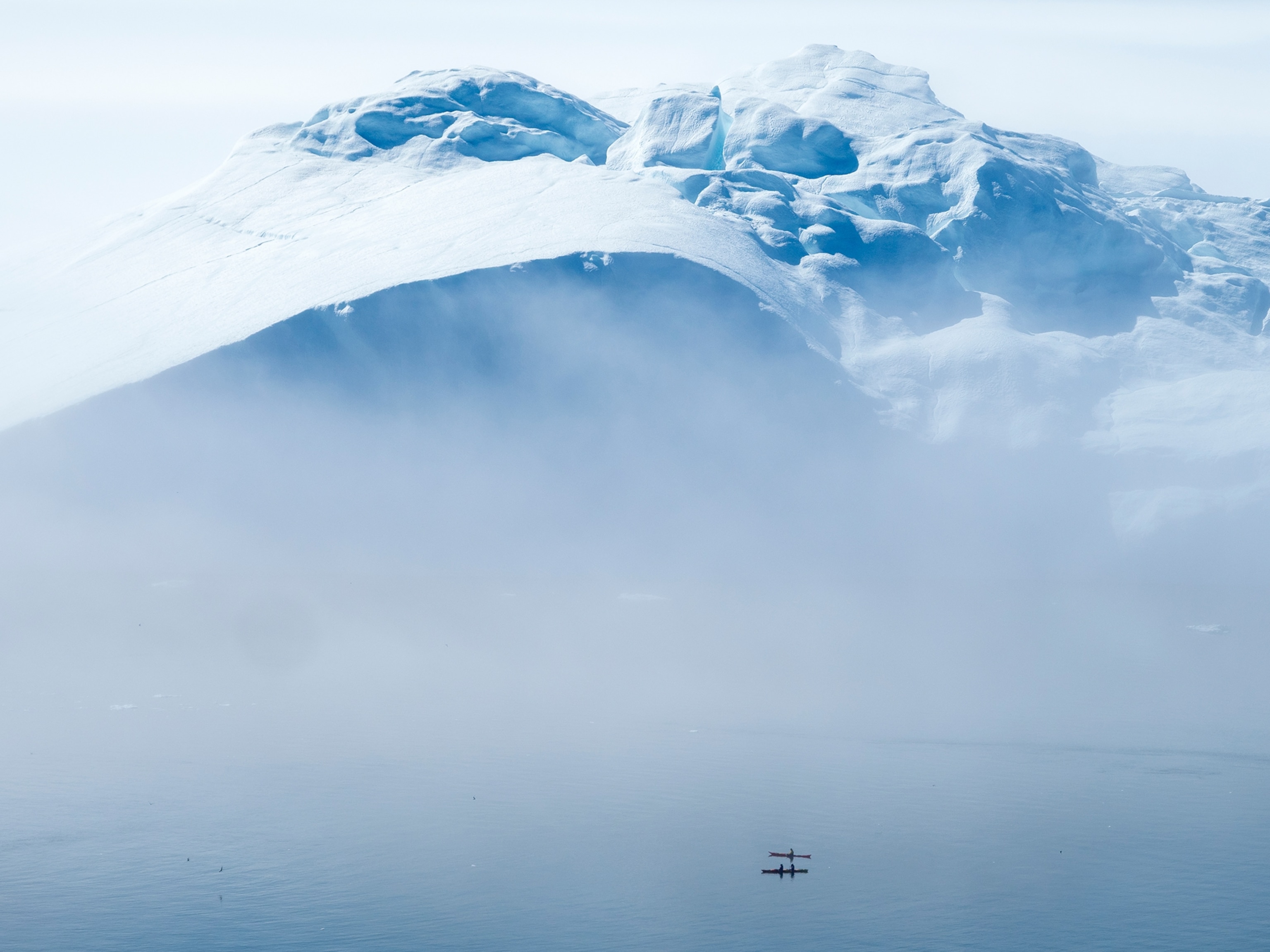 two Kayakers among icebergs in Disko Bay