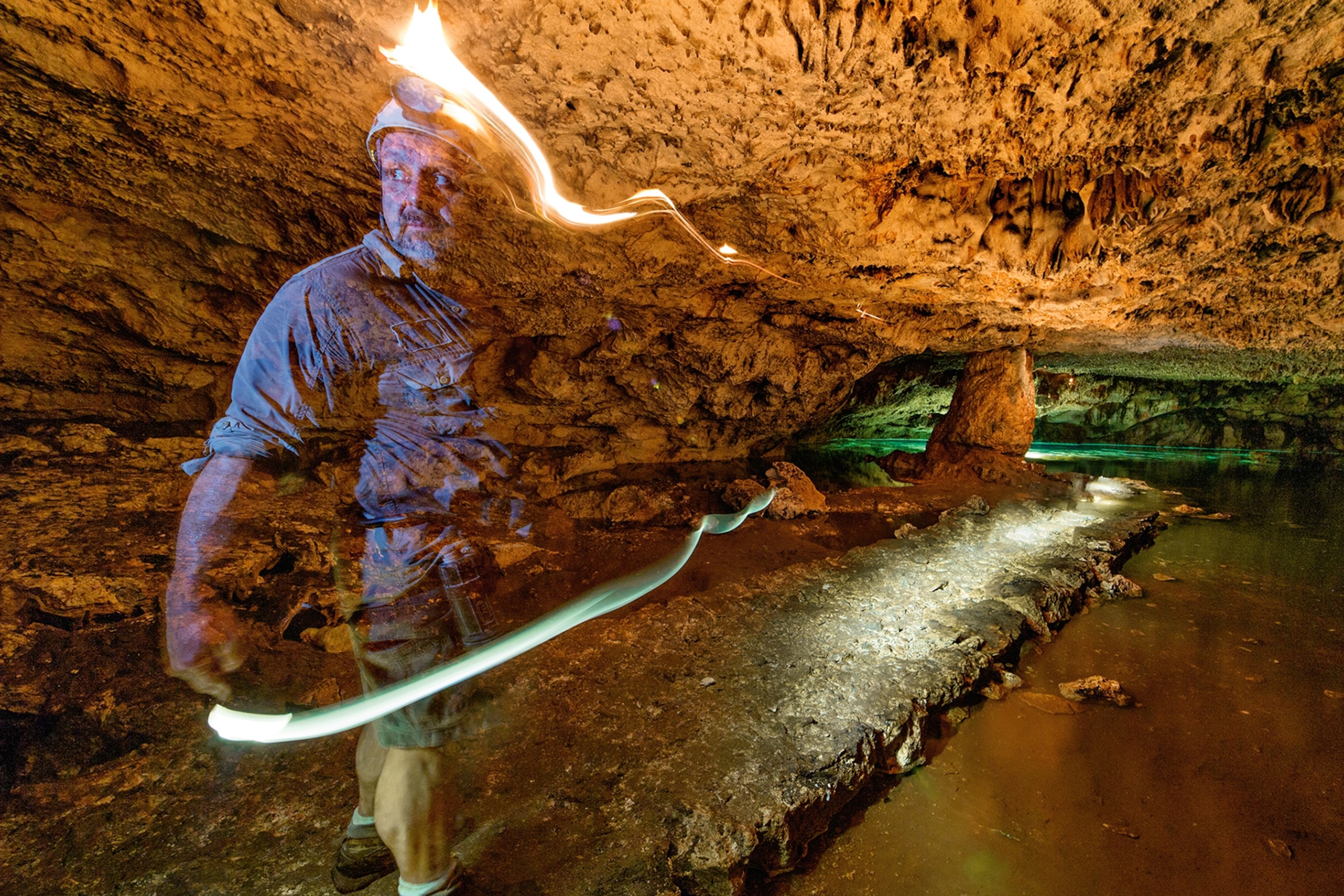 de Anda standing at a sacred path leading to a cenote