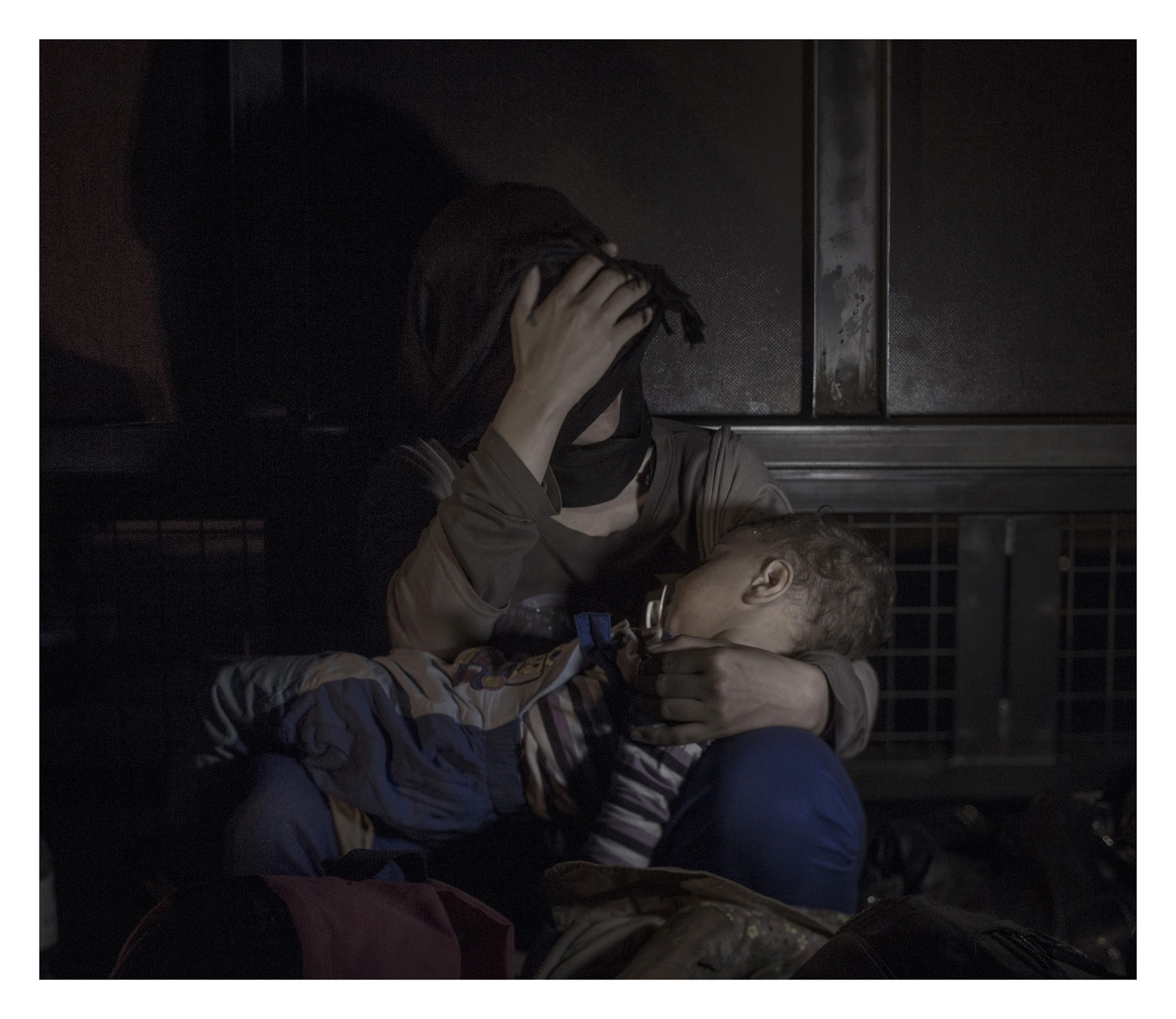 woman holding young child