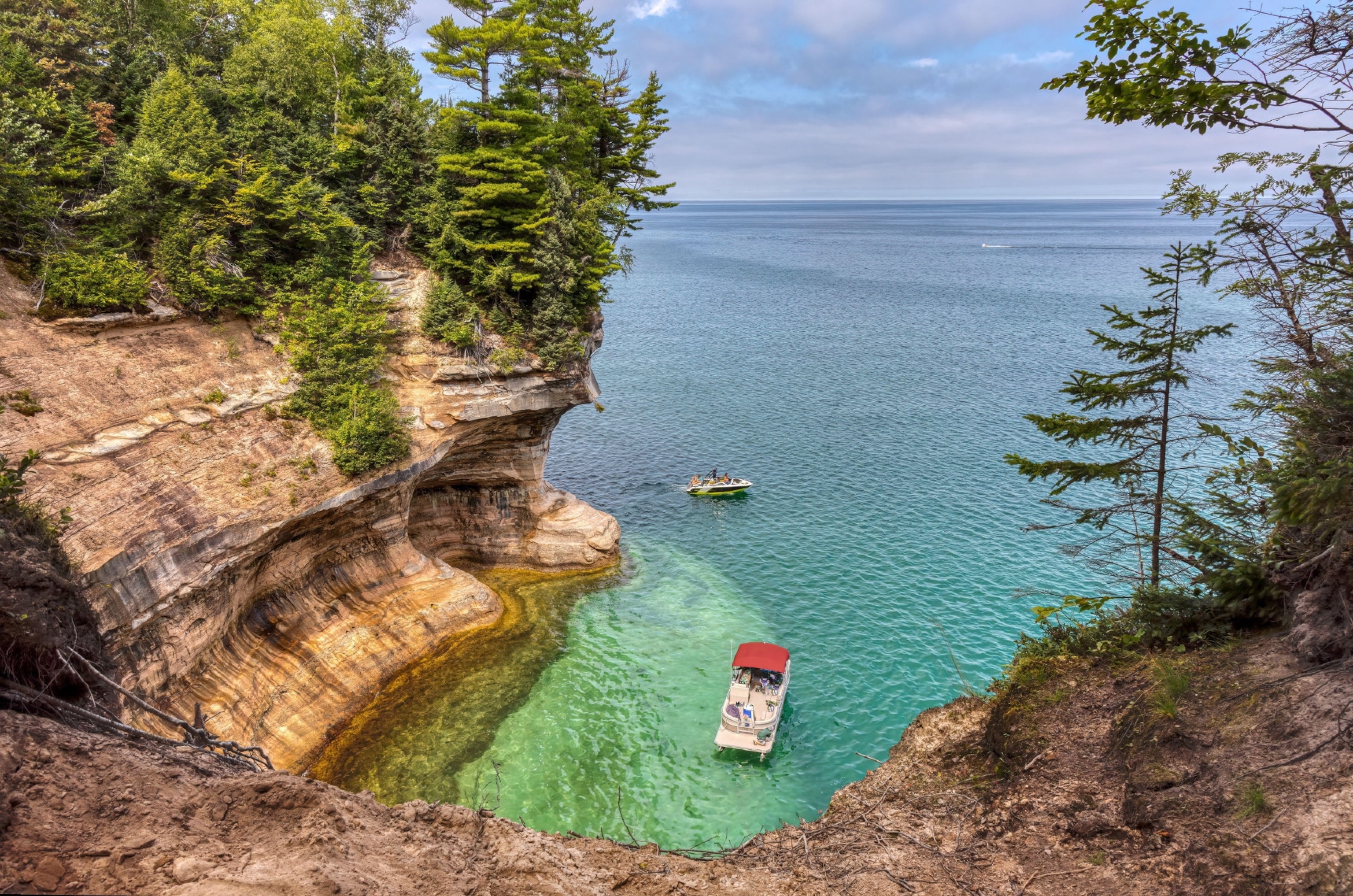 Landscape image of rock formation and turquoise lake