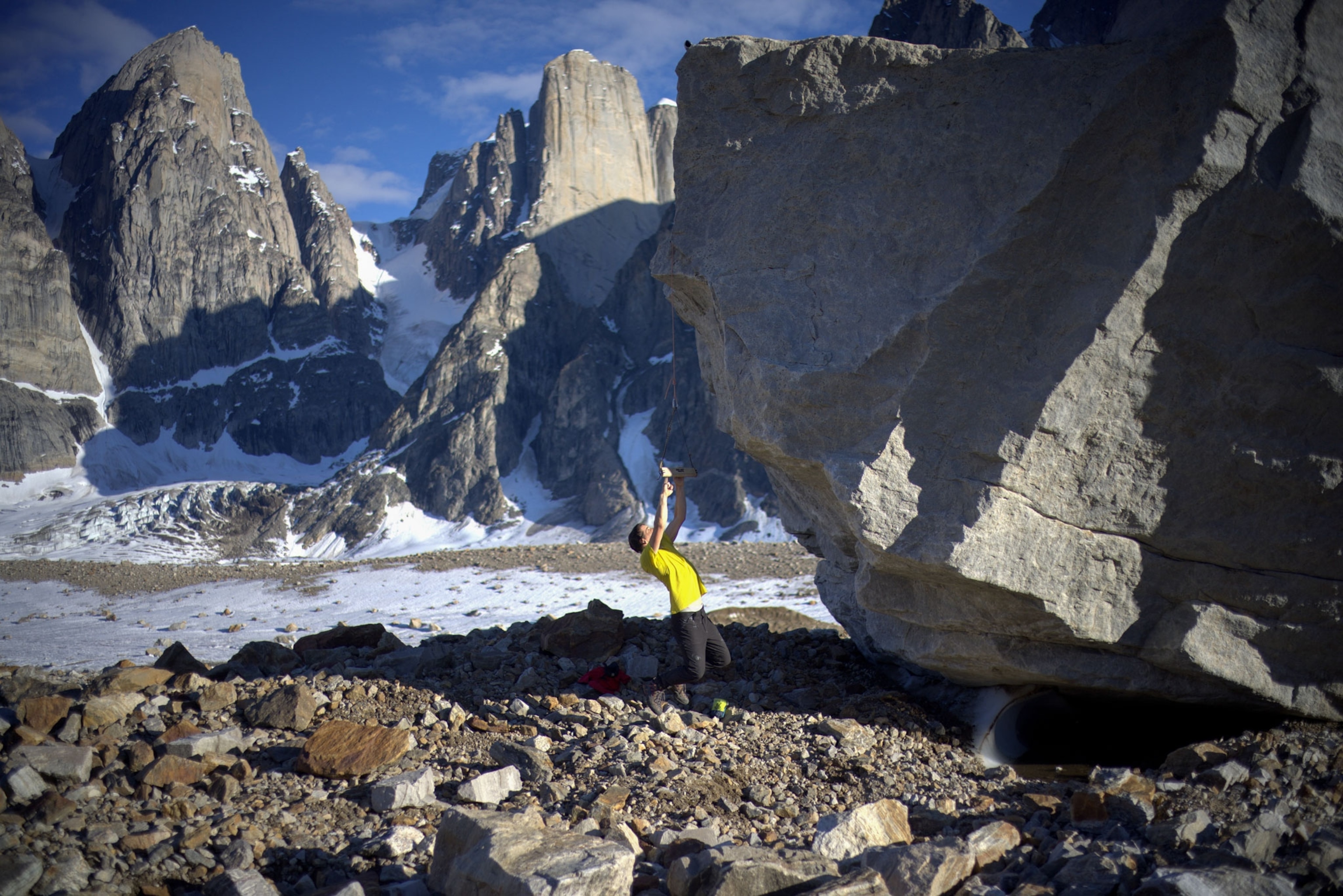 Alex Honnold exercises on a boulder in Greenland