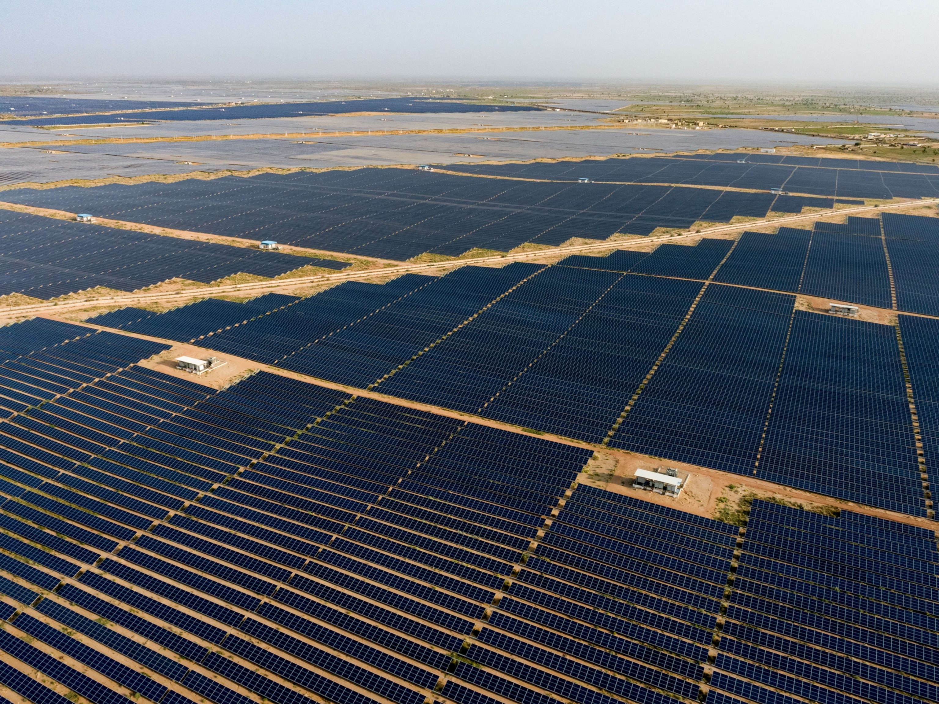 Picture of aerial of rows of solar panels.