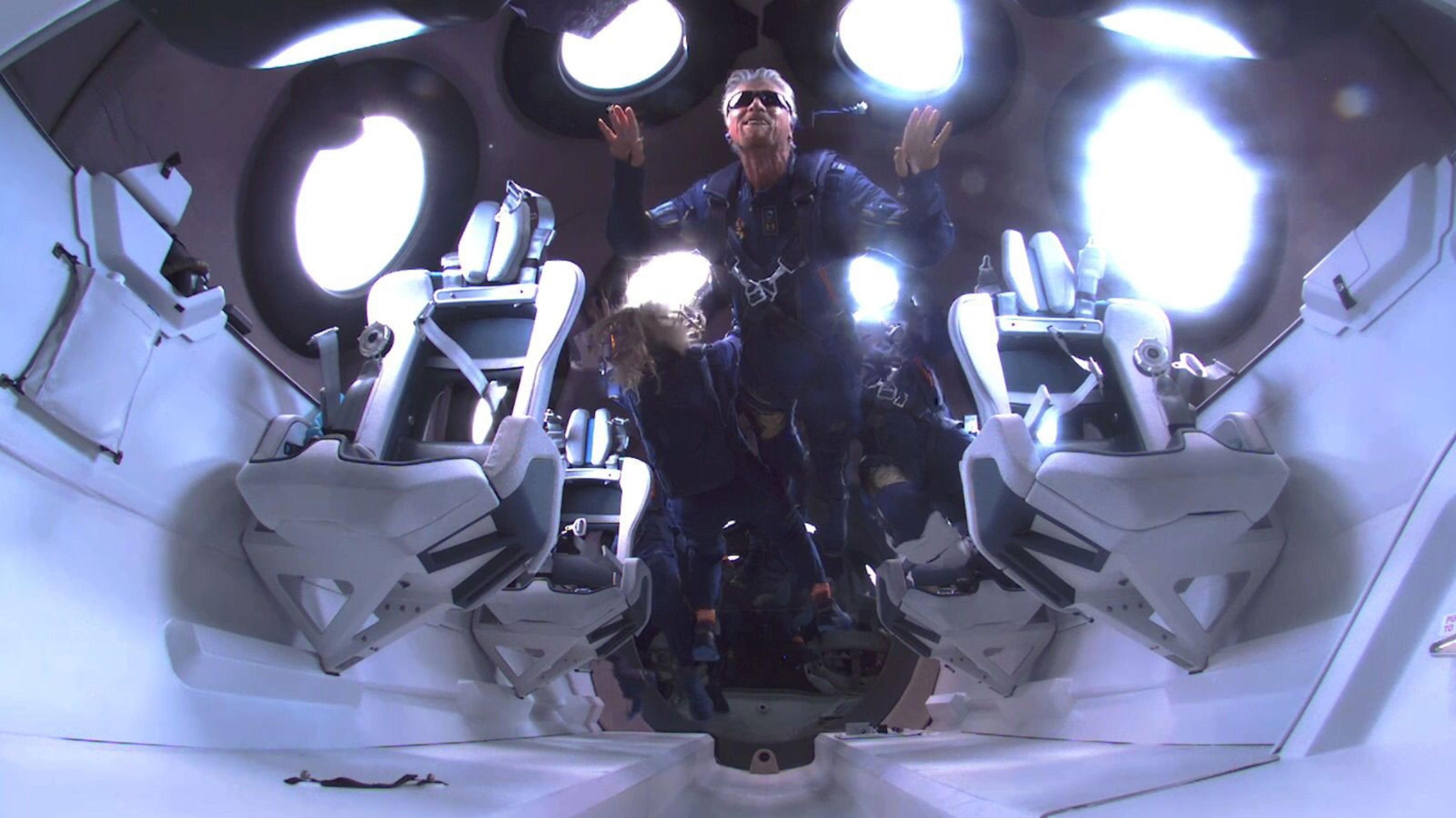 British billionaire Richard Branson floats weightlessly aboard Virgin Galactic Unity 22 Spaceflight.