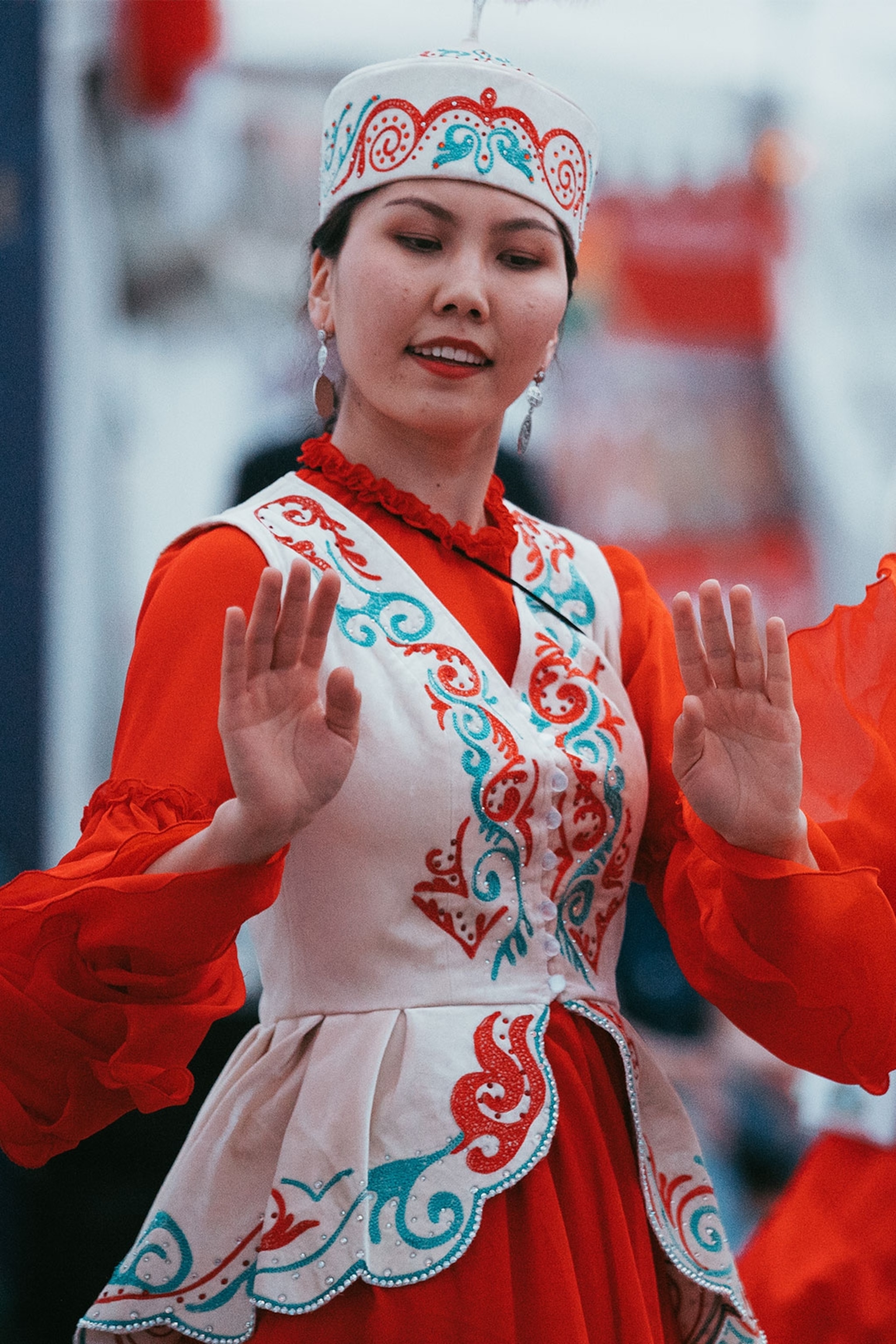 Lady dancing in traditional red and white costume