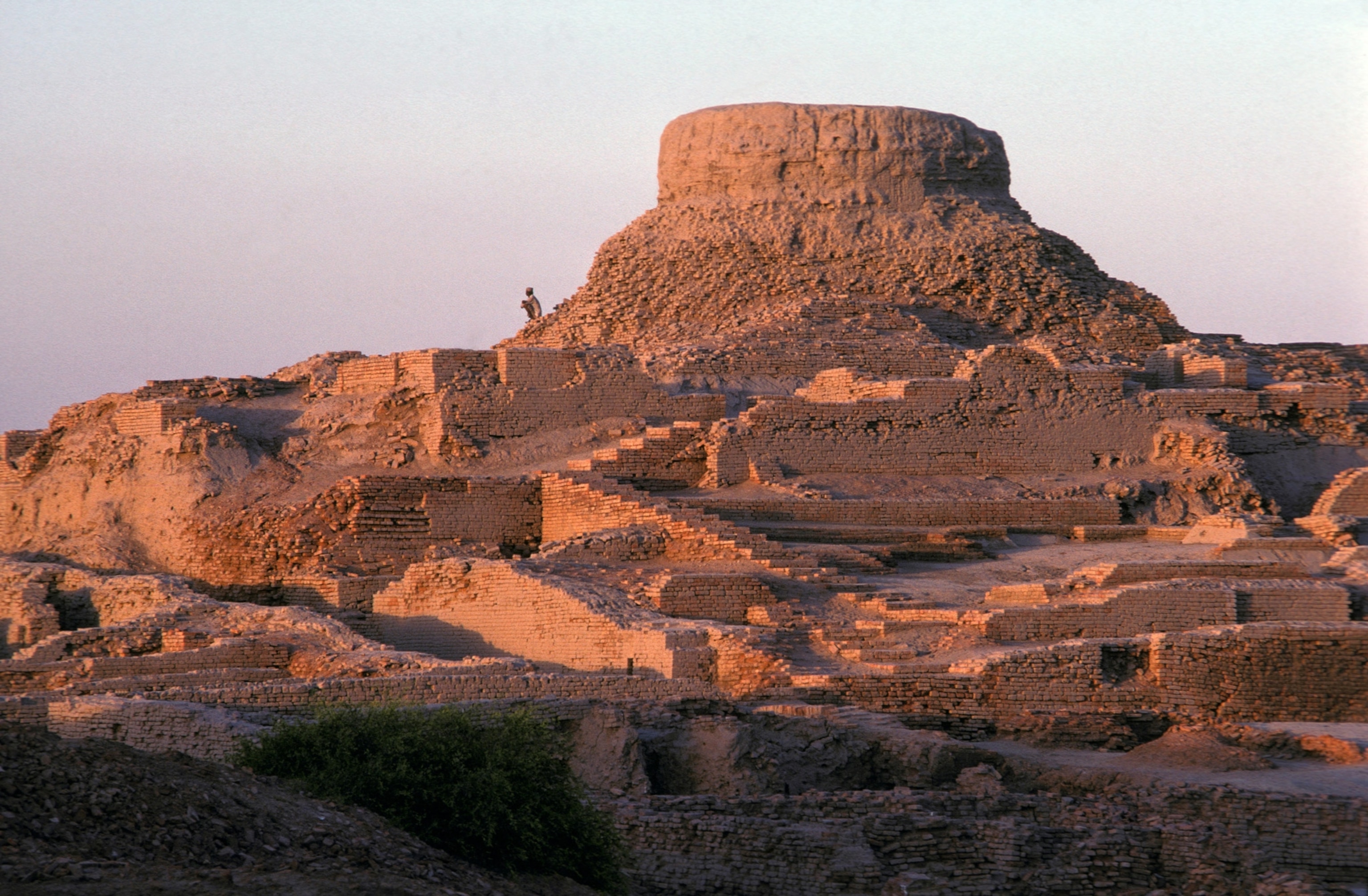 Photo of ancient city with crumbling brick structures.