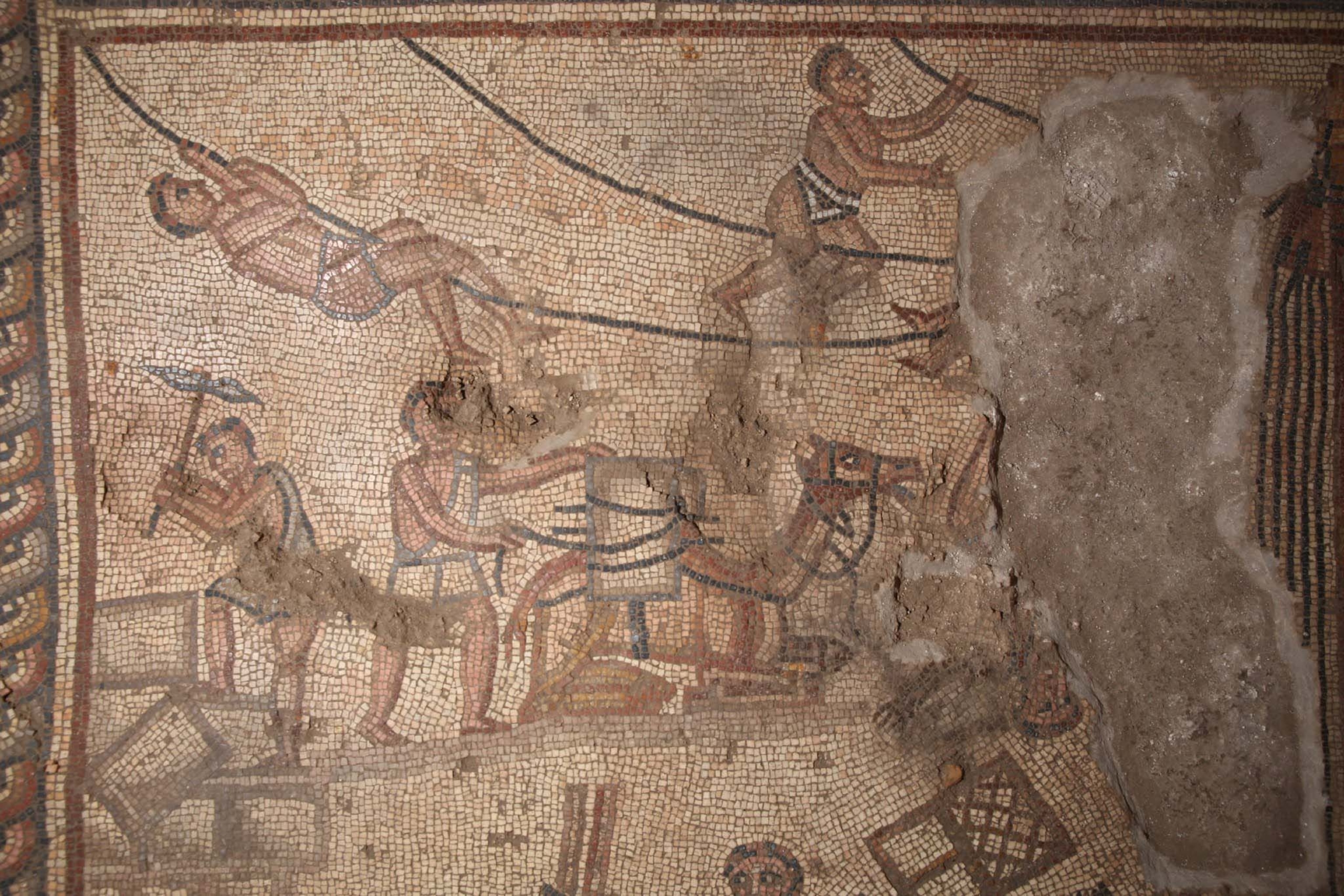detail of a mosaic floor shows workers building