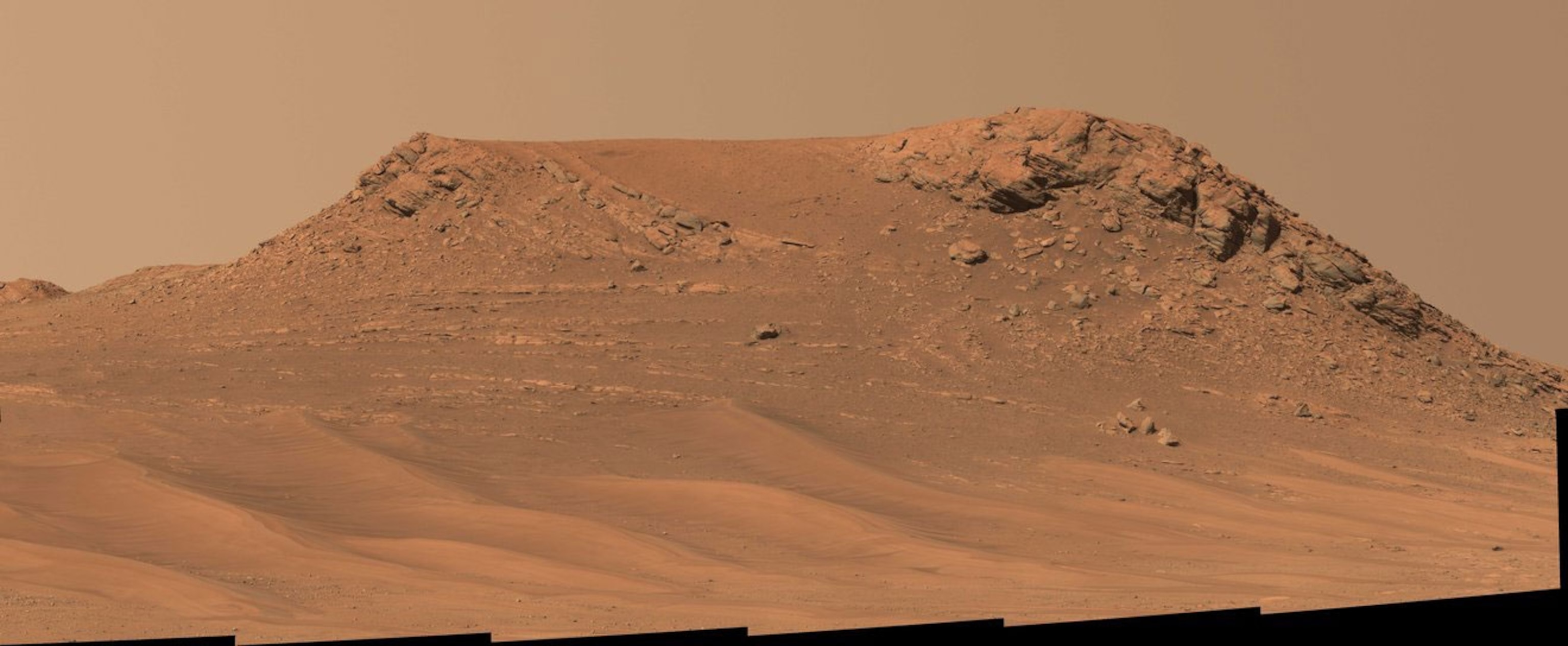 a mosaic of images capturing a red sandy martian landscape
