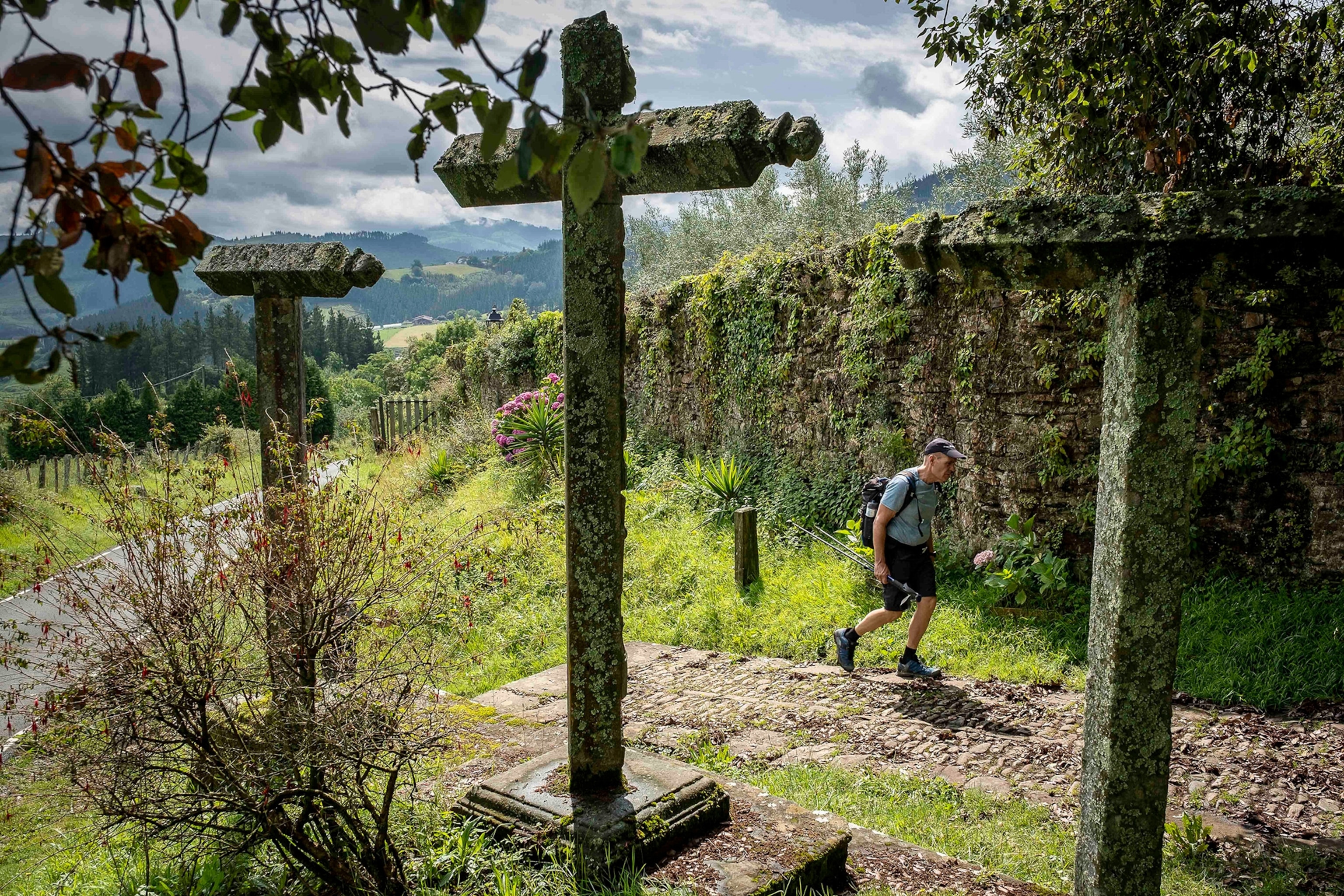 Pilgrim walking in the vicinity of Zenarruza monastery on the Camino del Norte, Spanish pilgrimage route to Santiago de Compostela.