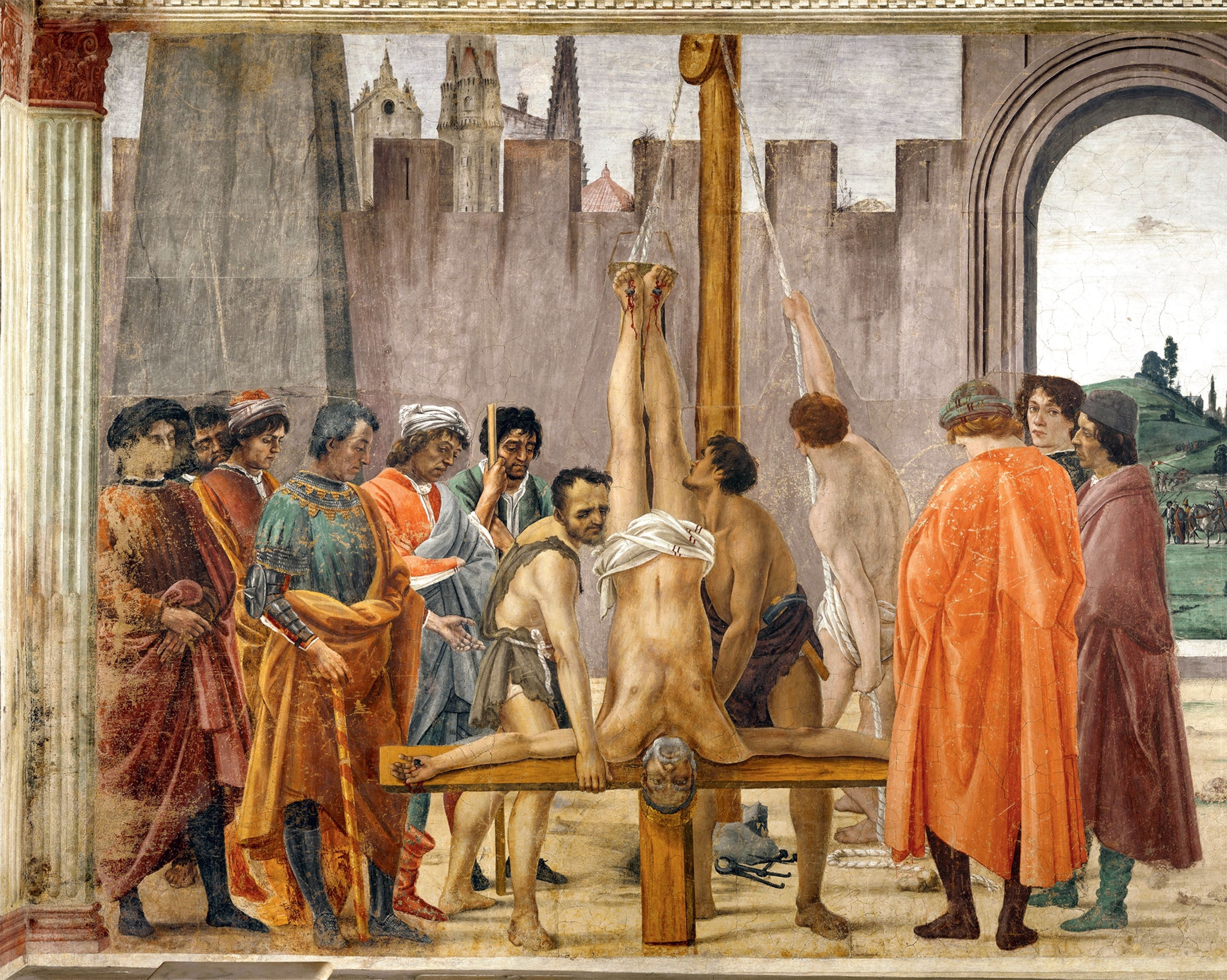 A painting shows Peter being crucified upside down