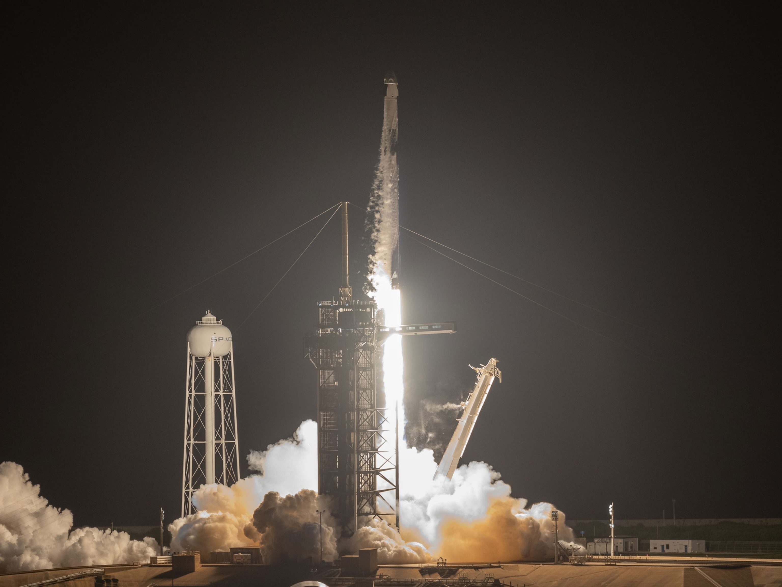 A SpaceX Falcon 9 rocket launches with the Inspiration4 mission as night settles over NASA's Kennedy Space Center, Sept. 15, 2021.