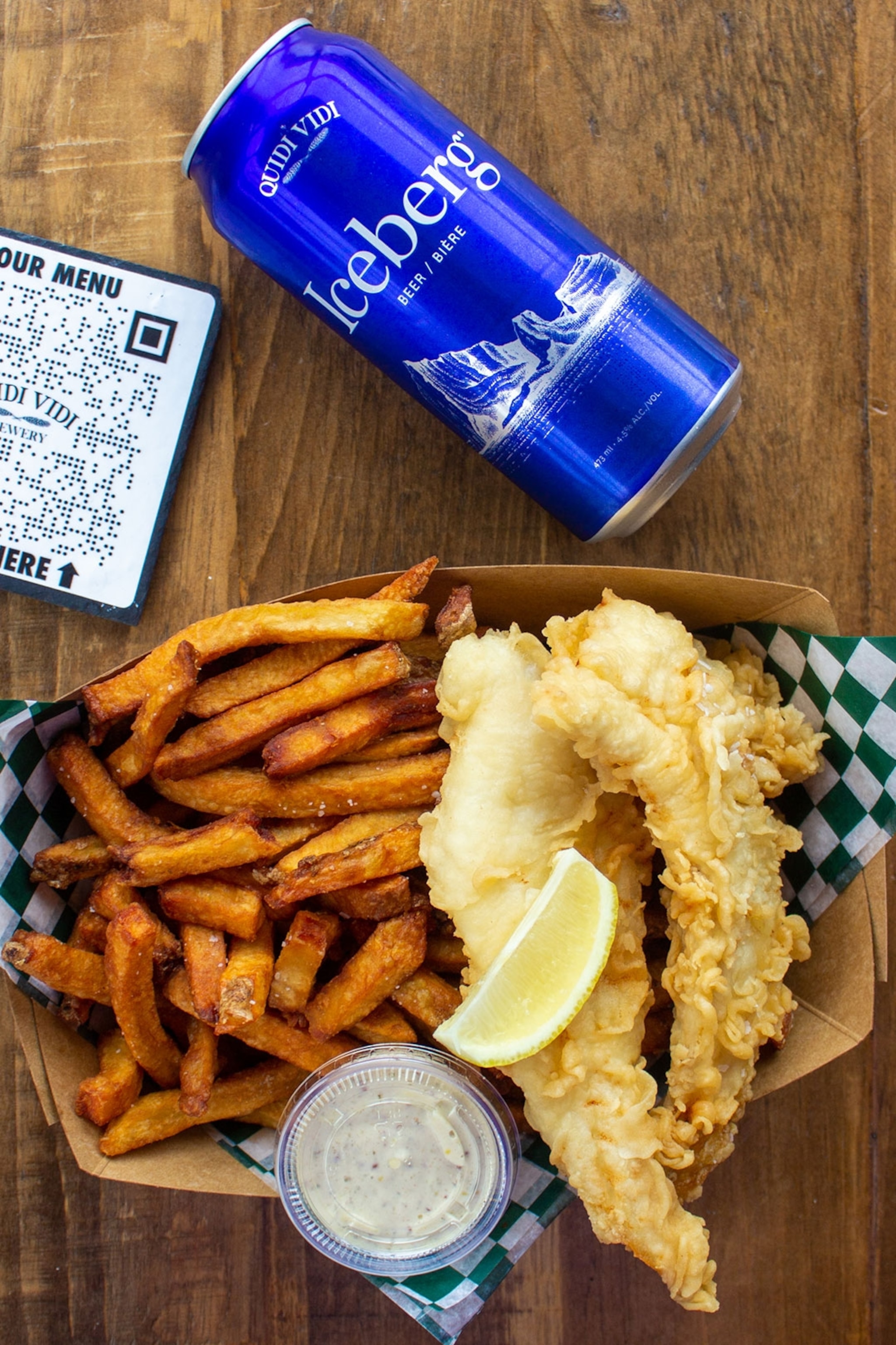A can of beer and a plate of fish and chips, Quidi Vidi Brewery, Newfoundland and Labrador, Canada.