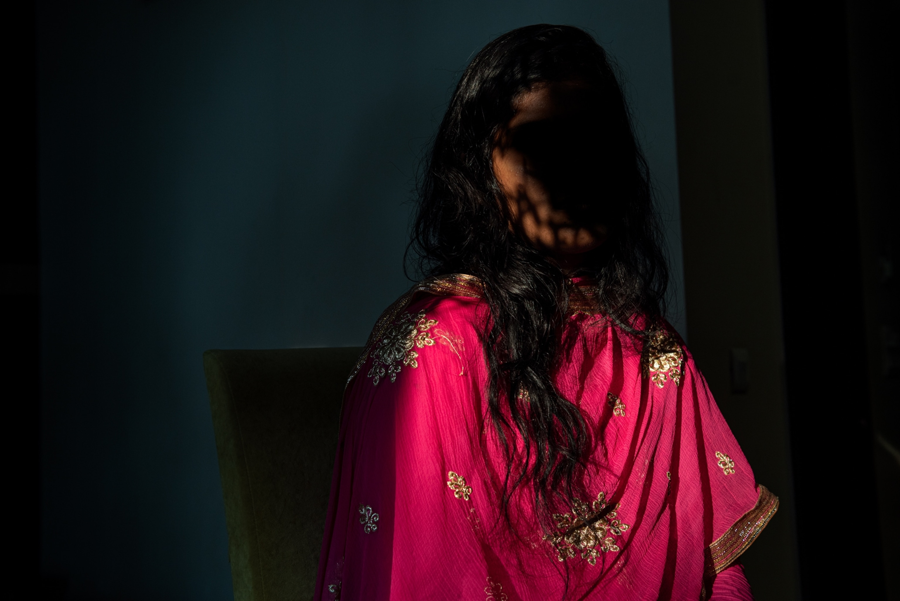 a woman in a hot pink sari