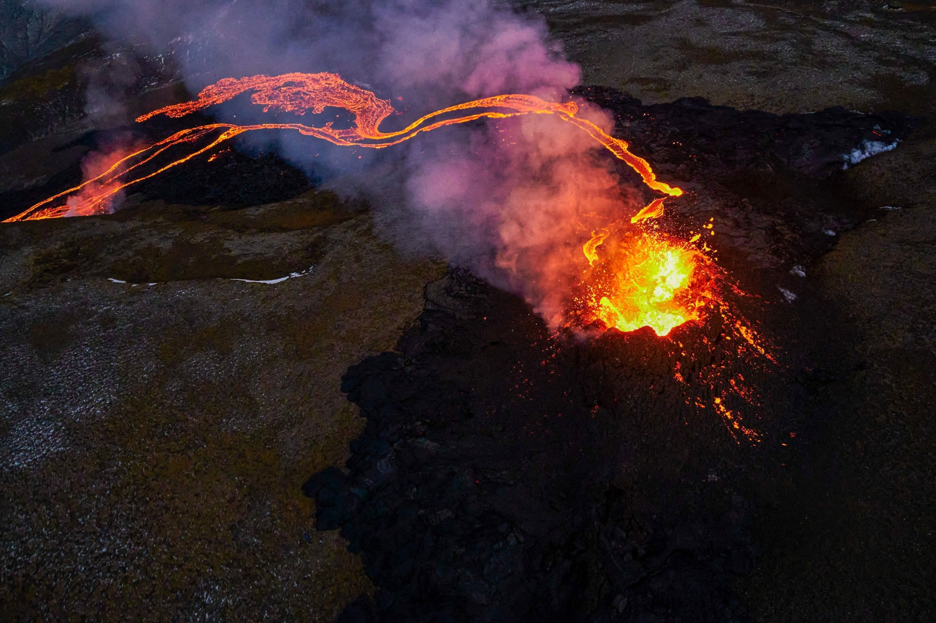 Lava flows from two fissures from a volcano near along the Fagradalsfjall on the Reykjanes Peninsula in Iceland on April 6, 2021.