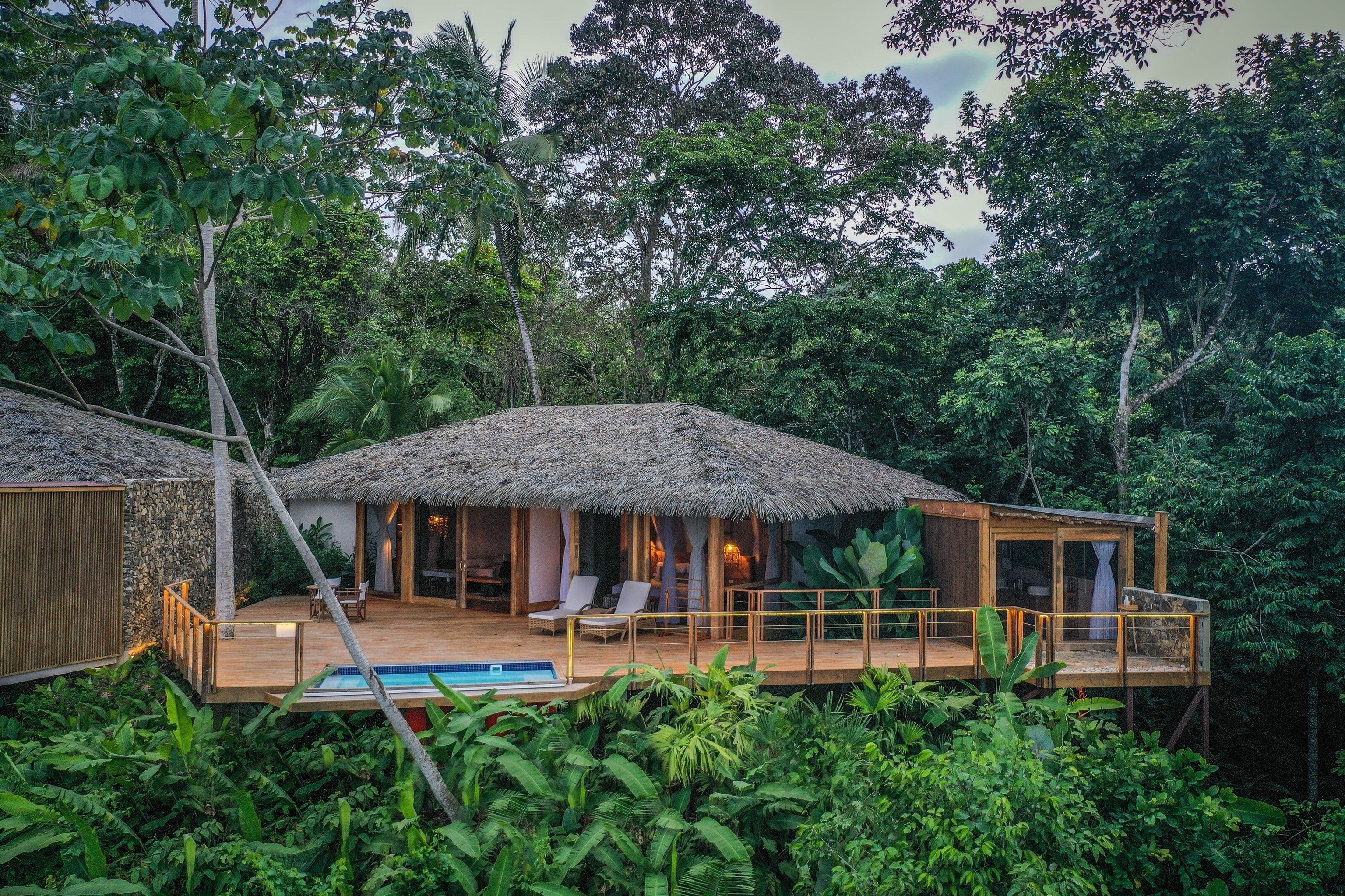Villa with a thatched roof in the jungle