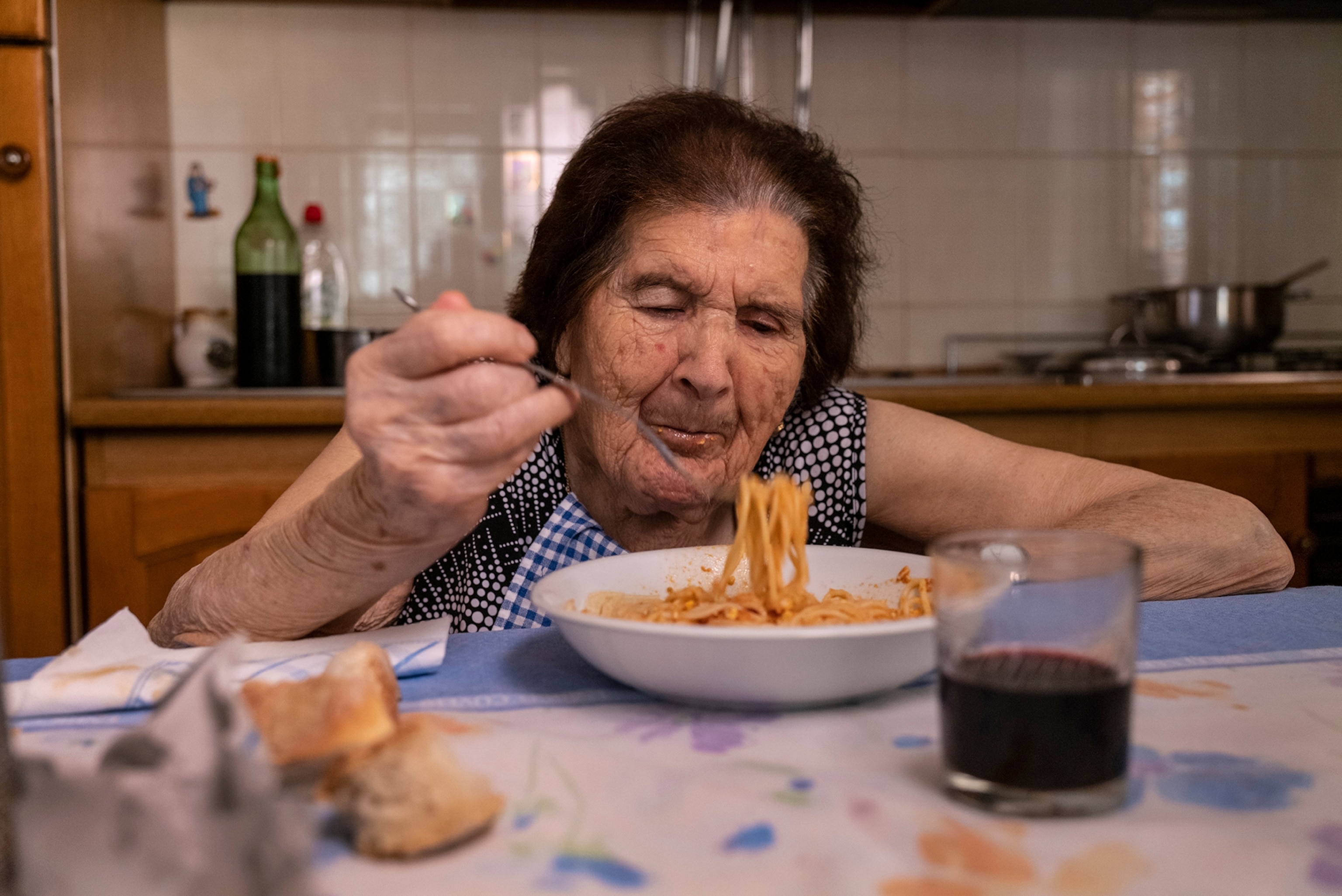 Centenarian eating dinner