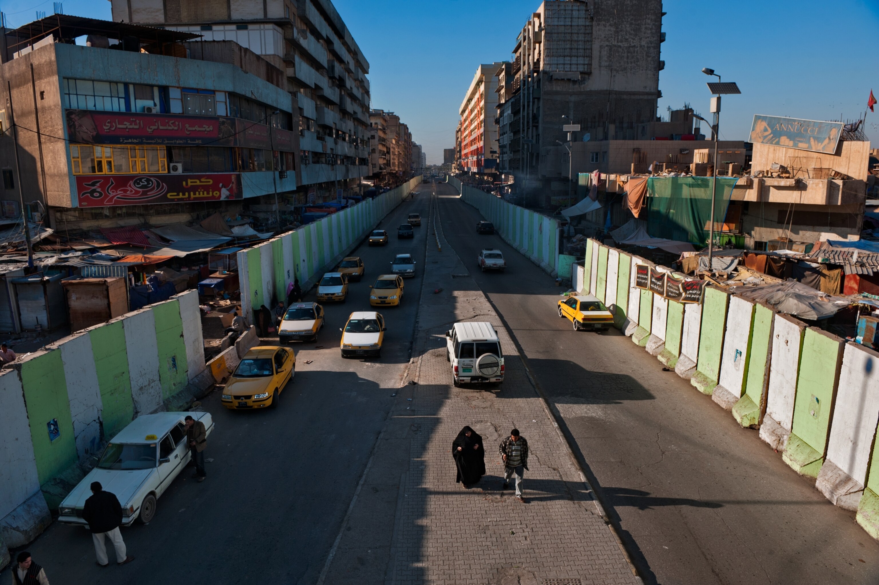 pedestrians on Al Jumhuriyah Street