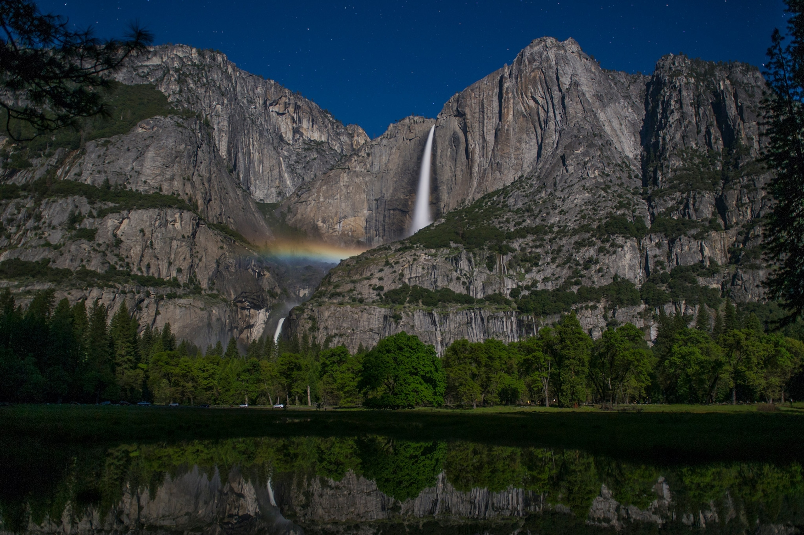 Lunar rainbow moonbow with reflection at Yosemite Falls in Yosemite National Park