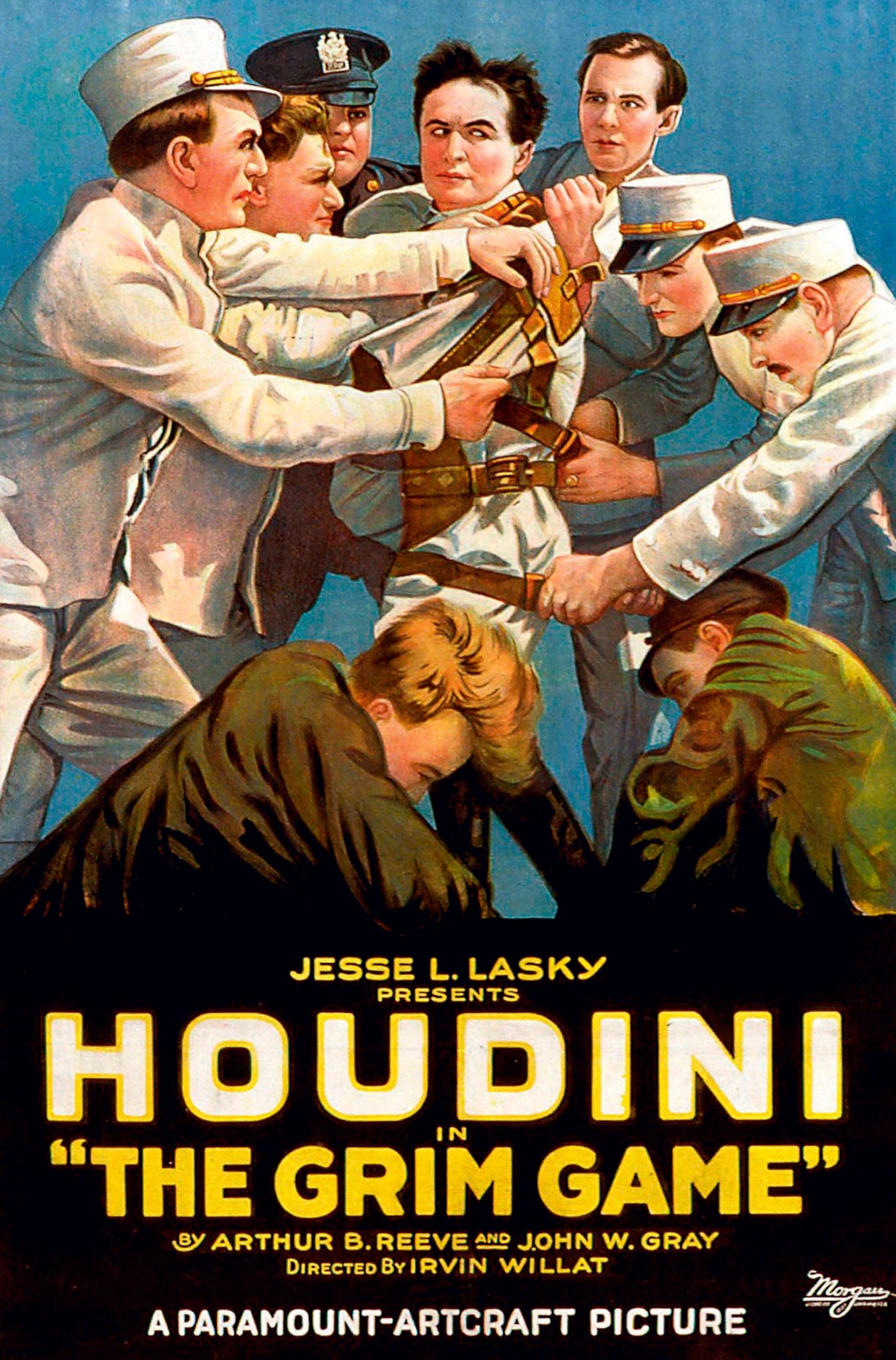 A blue poster with 8 people restraining a man looking like Houdini in a straight jacket, with text "Houdini The Grim Game"