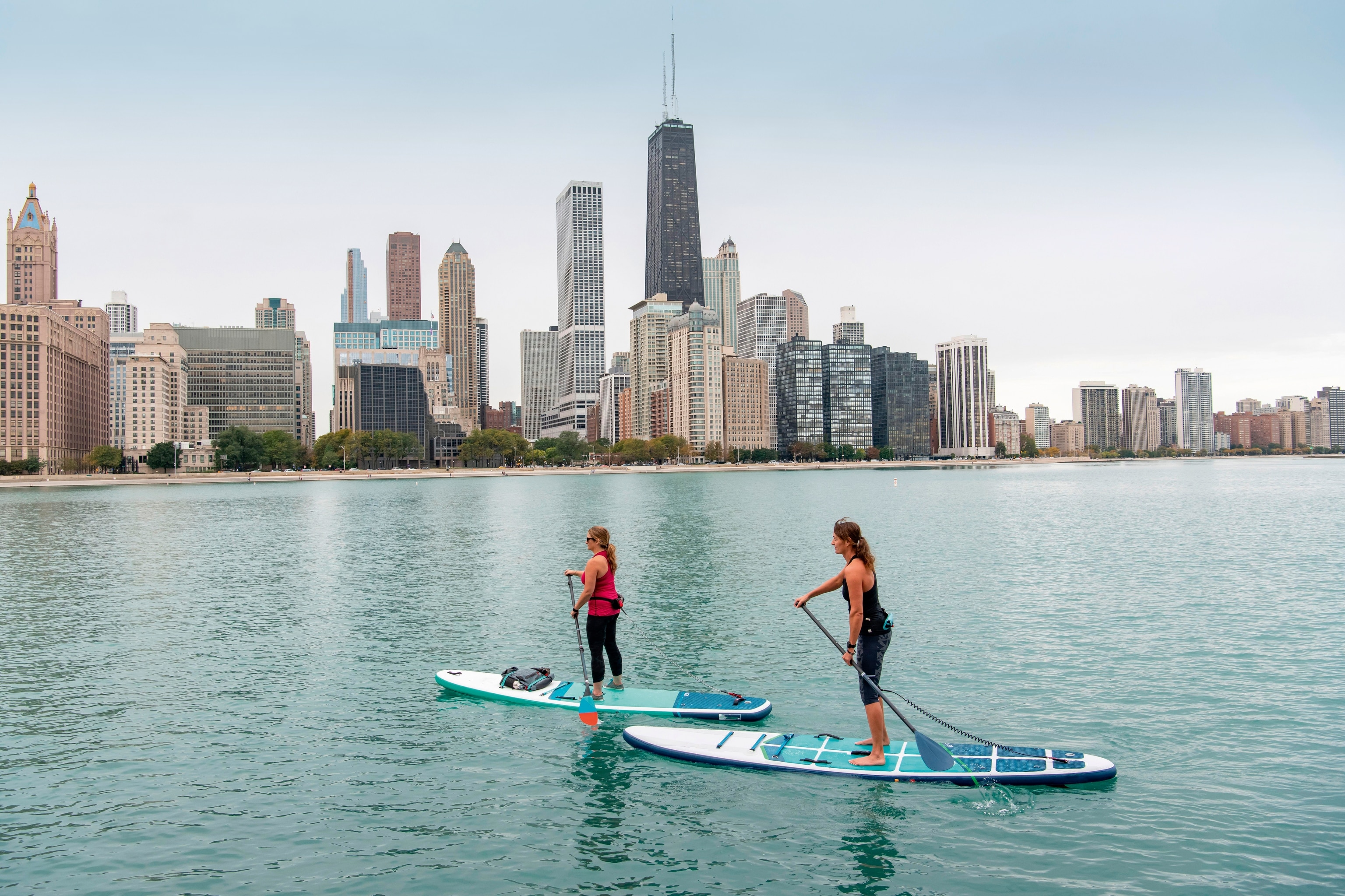 paddleboarders on lake michigan