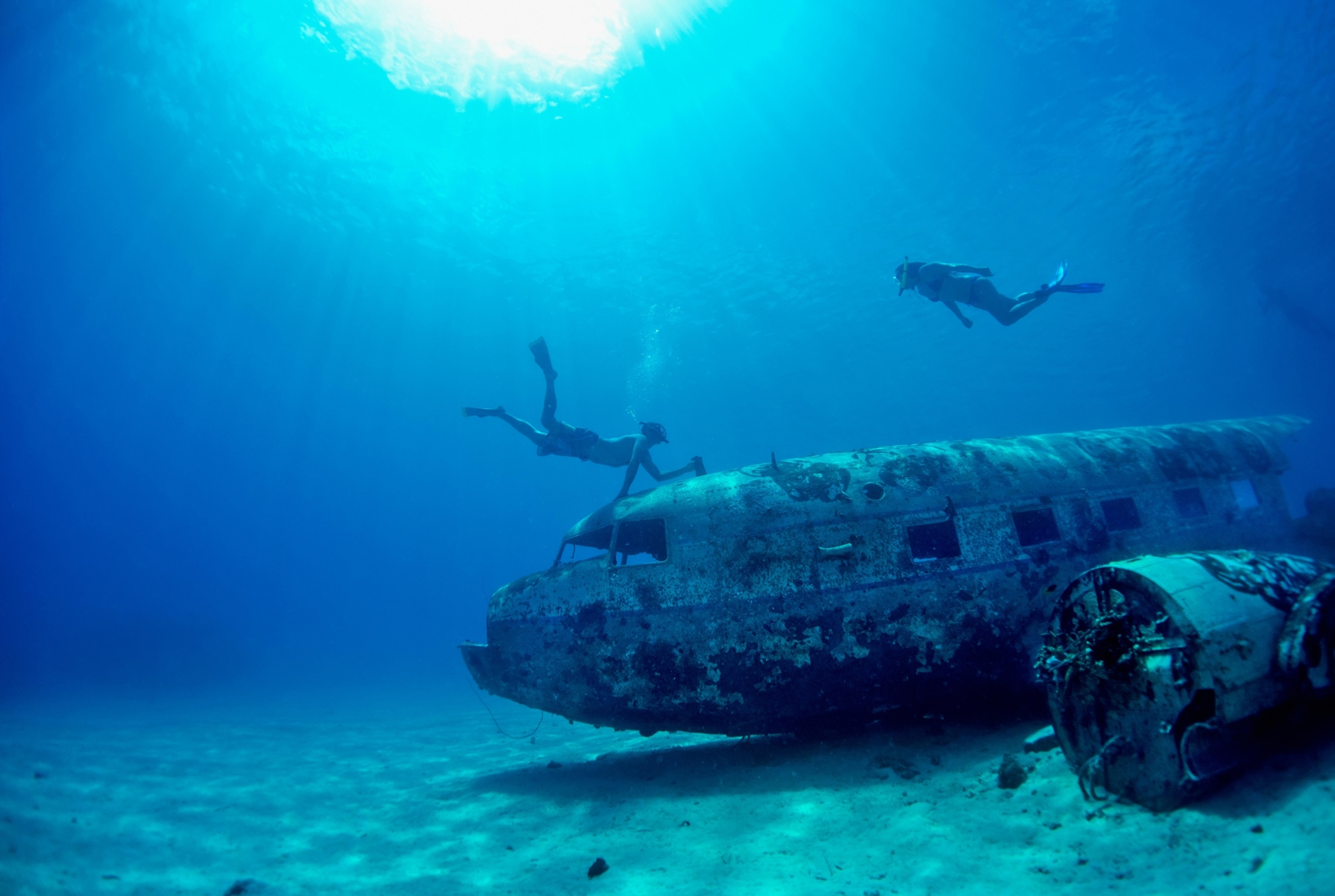 snorkelers at a plane wreck, near Majuro, Marshall Islands