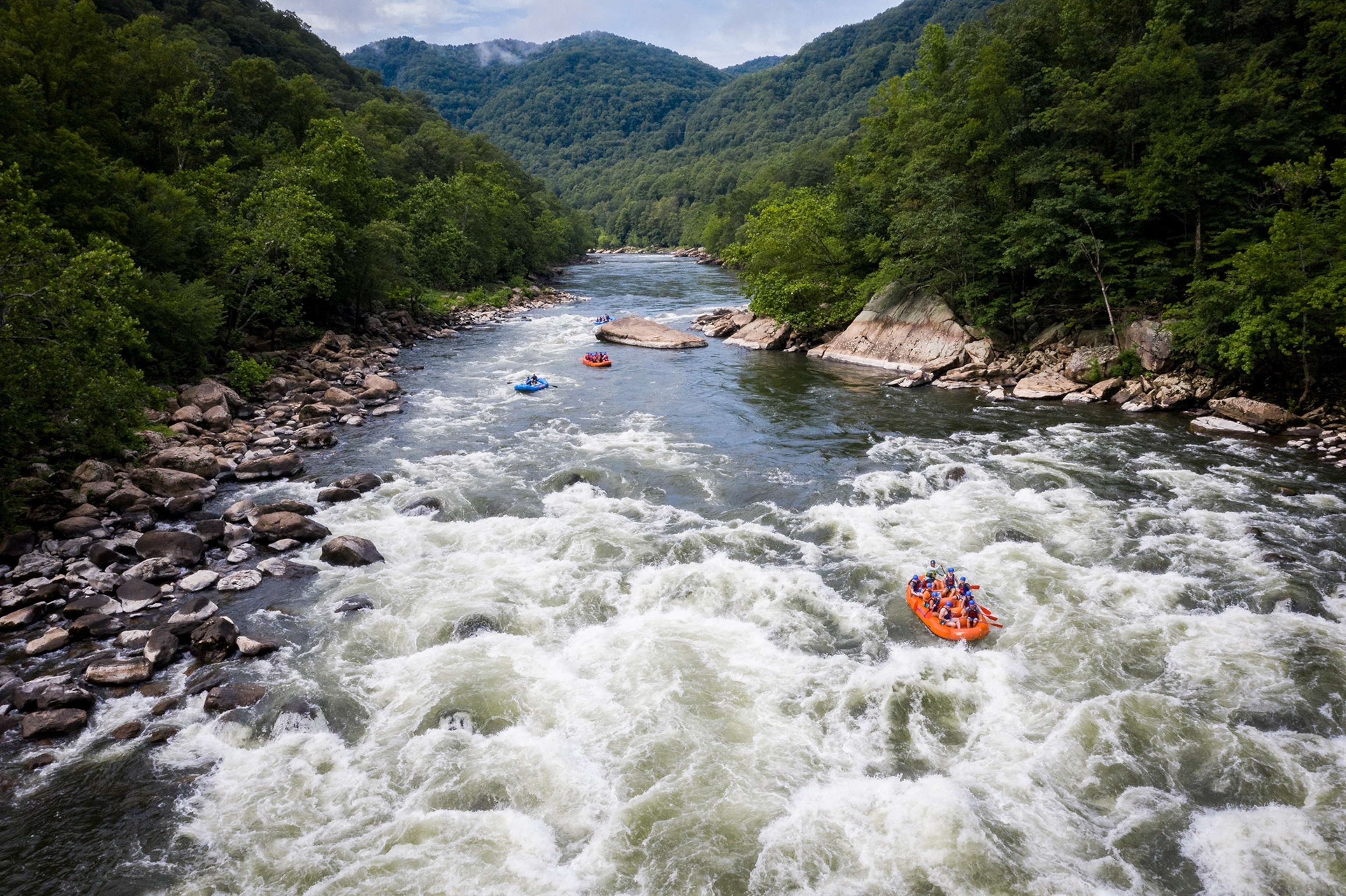 rafts going down rapids on the lower New River Gorge