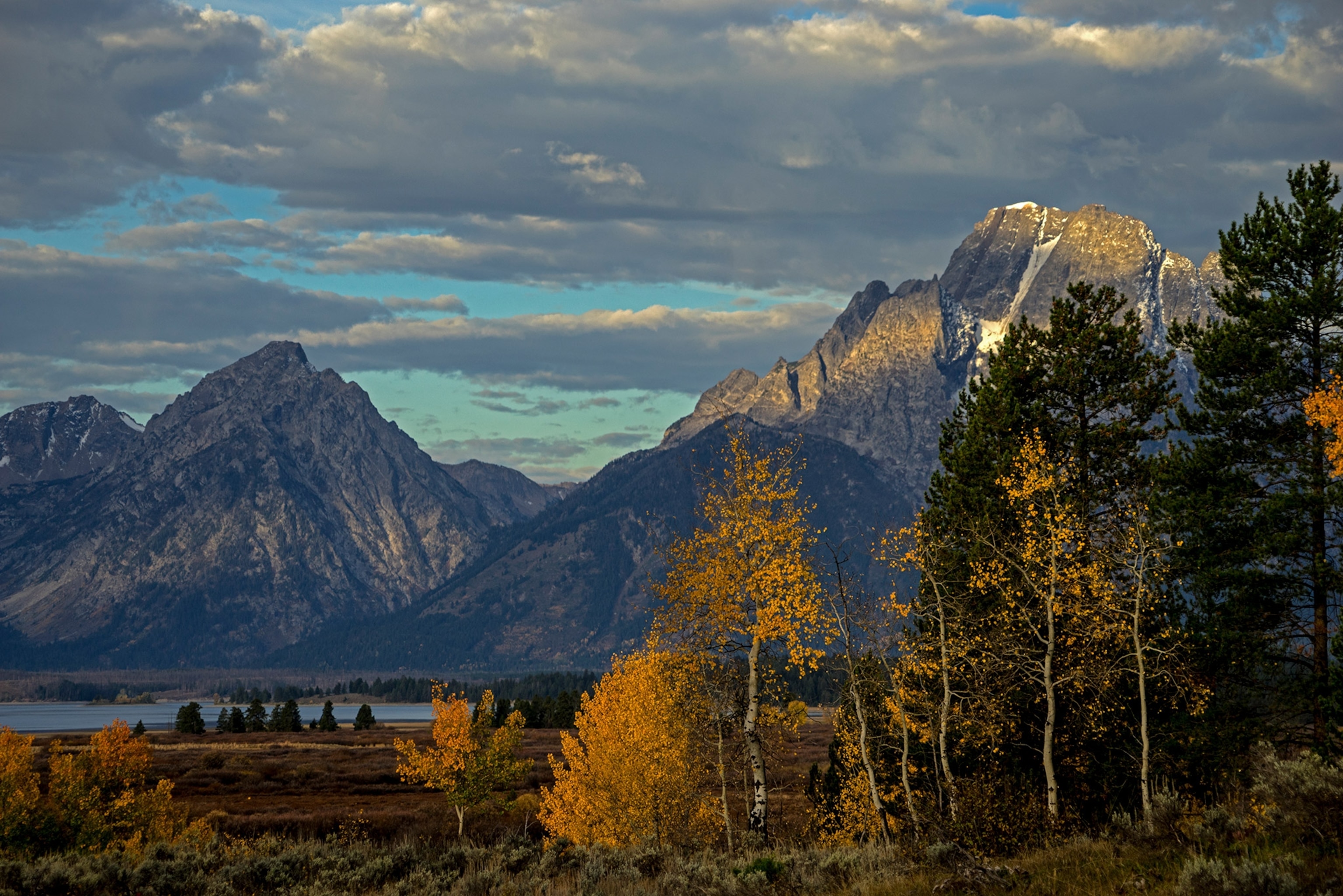 Grand Teton mountains and trees in autumn in Wyoming