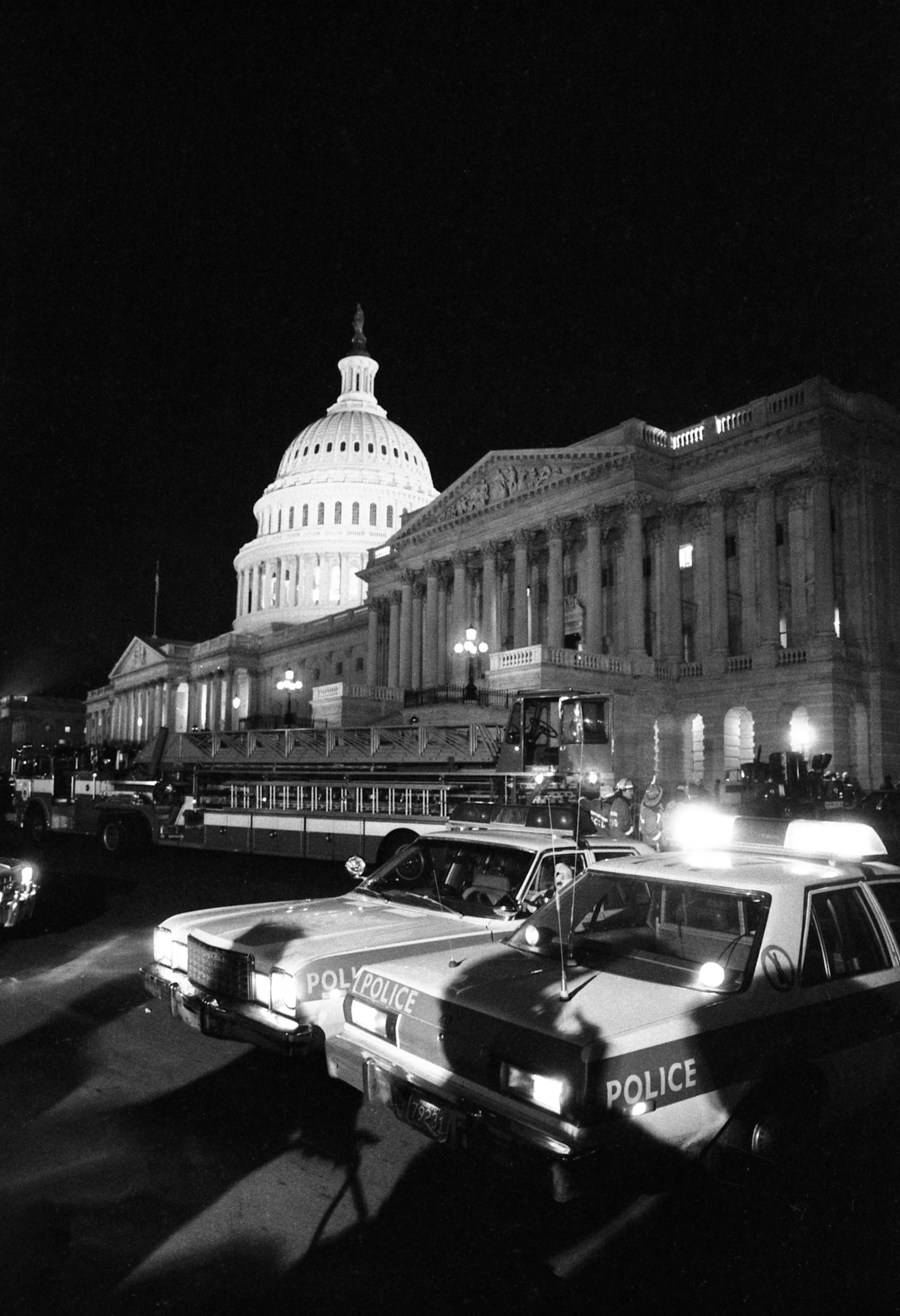 police cars outside the United States Capitol at night