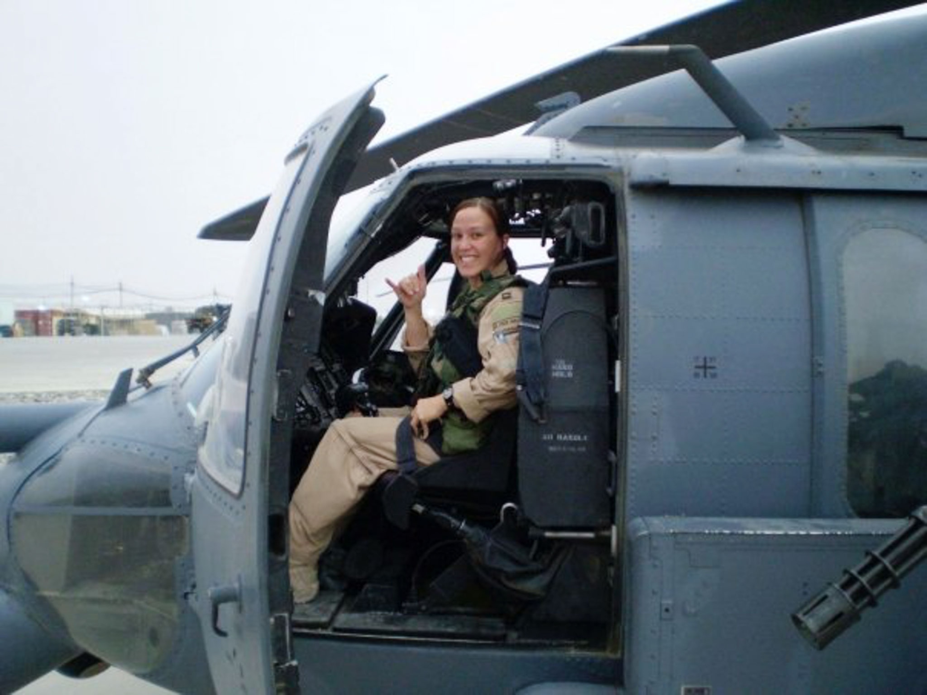 a female helicopter pilot inside a helicopter