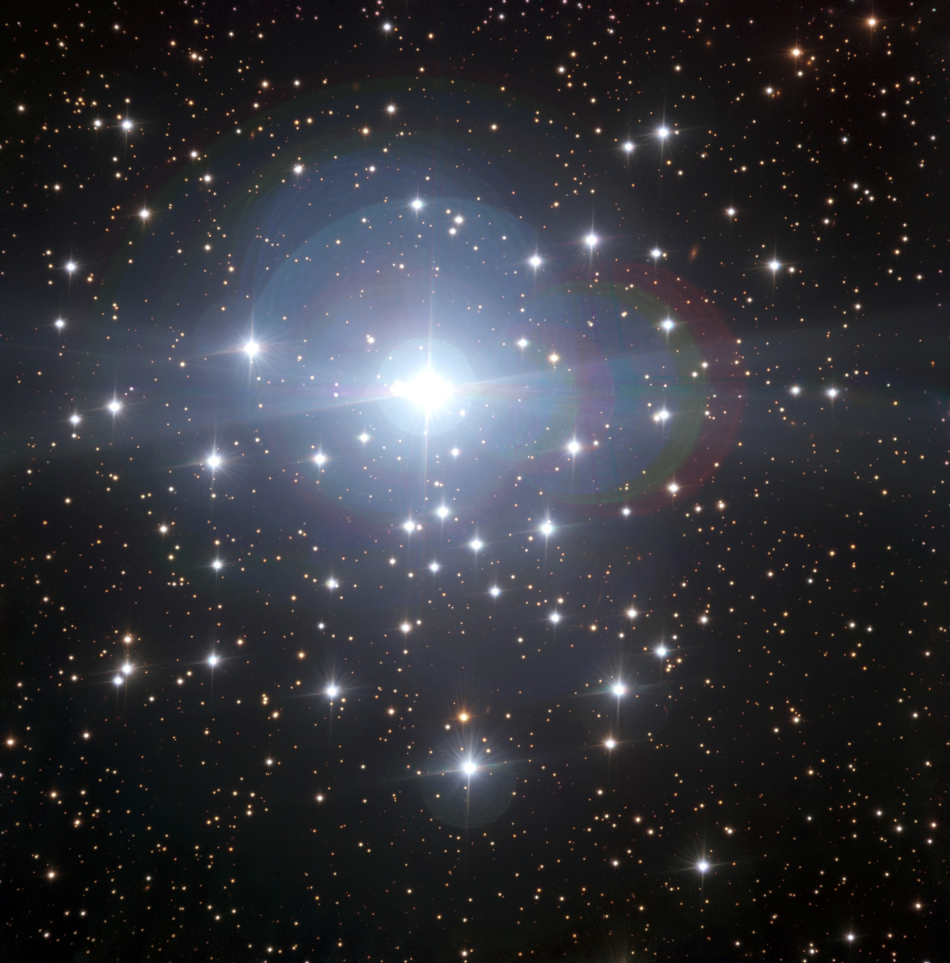 the massive multiple star system Tau Canis Majoris.
